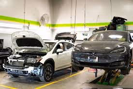 Tesla awaiting repair at a certified collision center instead of a generic body shop