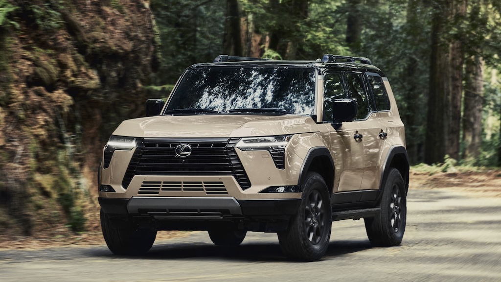 Tan Lexus GX SUV on a forest trail