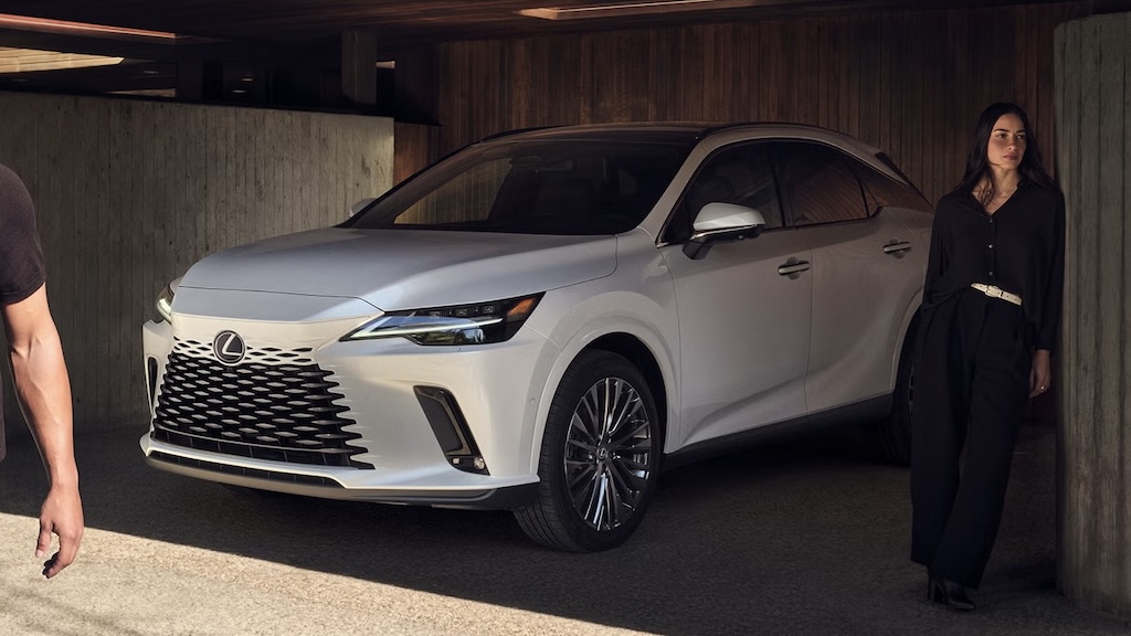 White Lexus RX SUV parked in a concrete garage