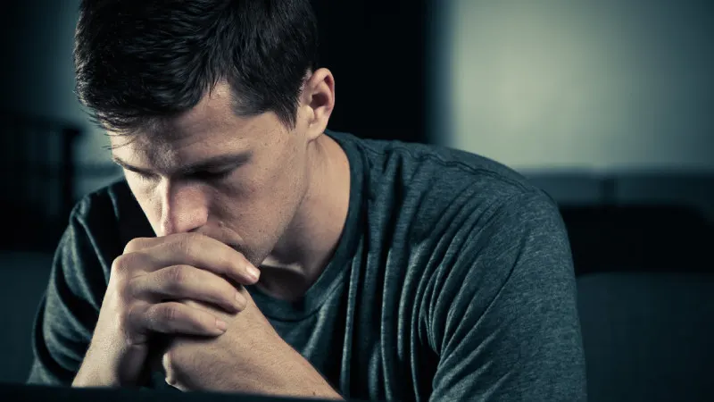 Man praying to God with a submissive heart