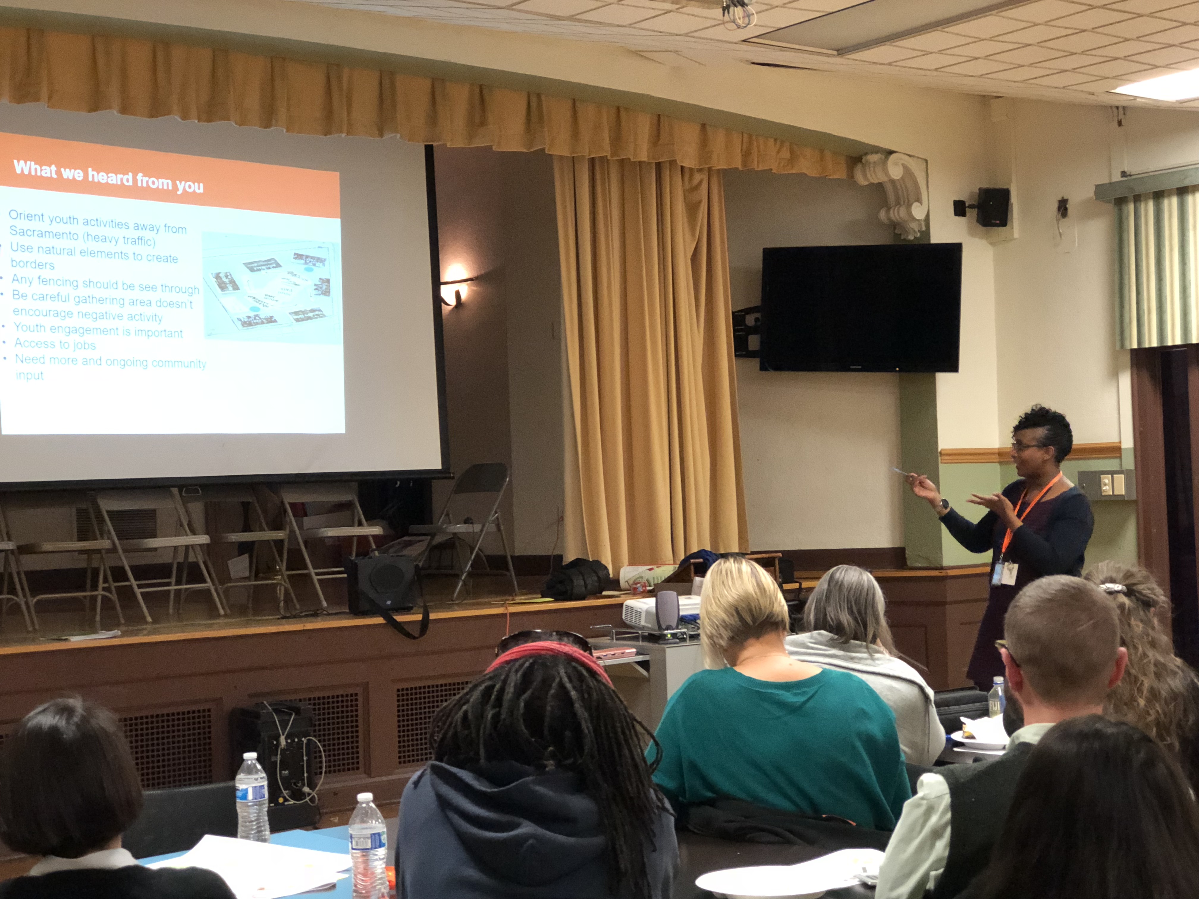 Residents attend a communiy meeting in 2018