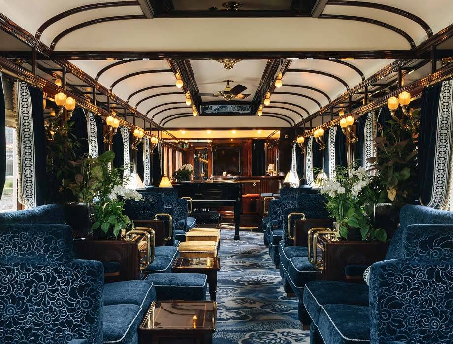 Luxury train carriage interior with blue velvet armchairs