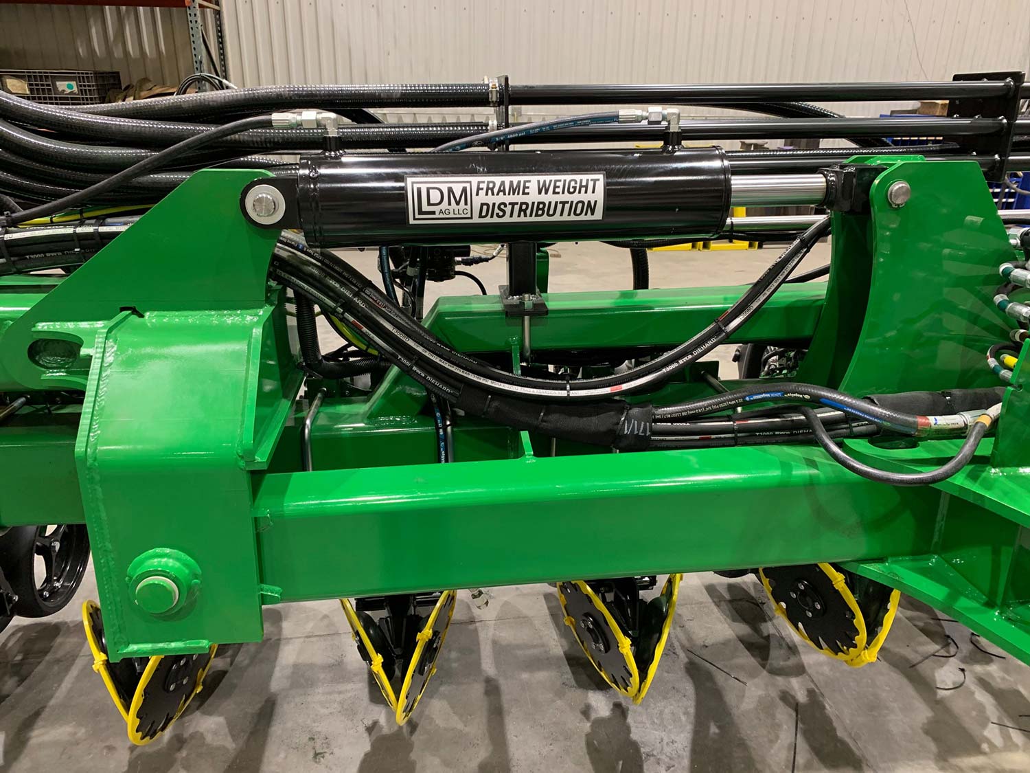 Another way to disperse the weight on heavy center-fill planters is with a hydraulic weight transfer system like the one above from LDM Ag.