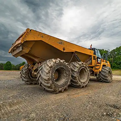 articulated dump truck with flotation tires