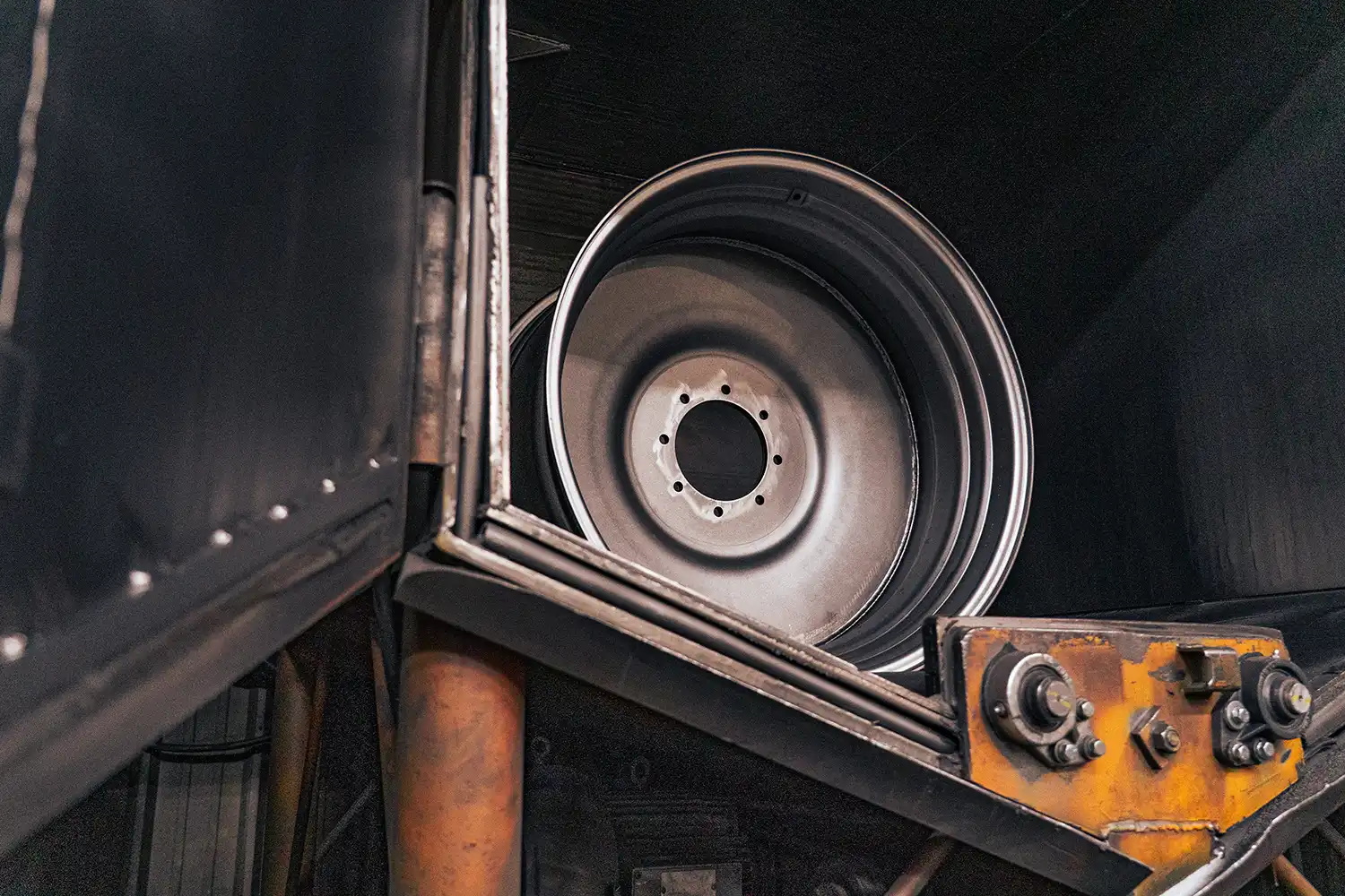 shot-blasting a wheel before powder coat