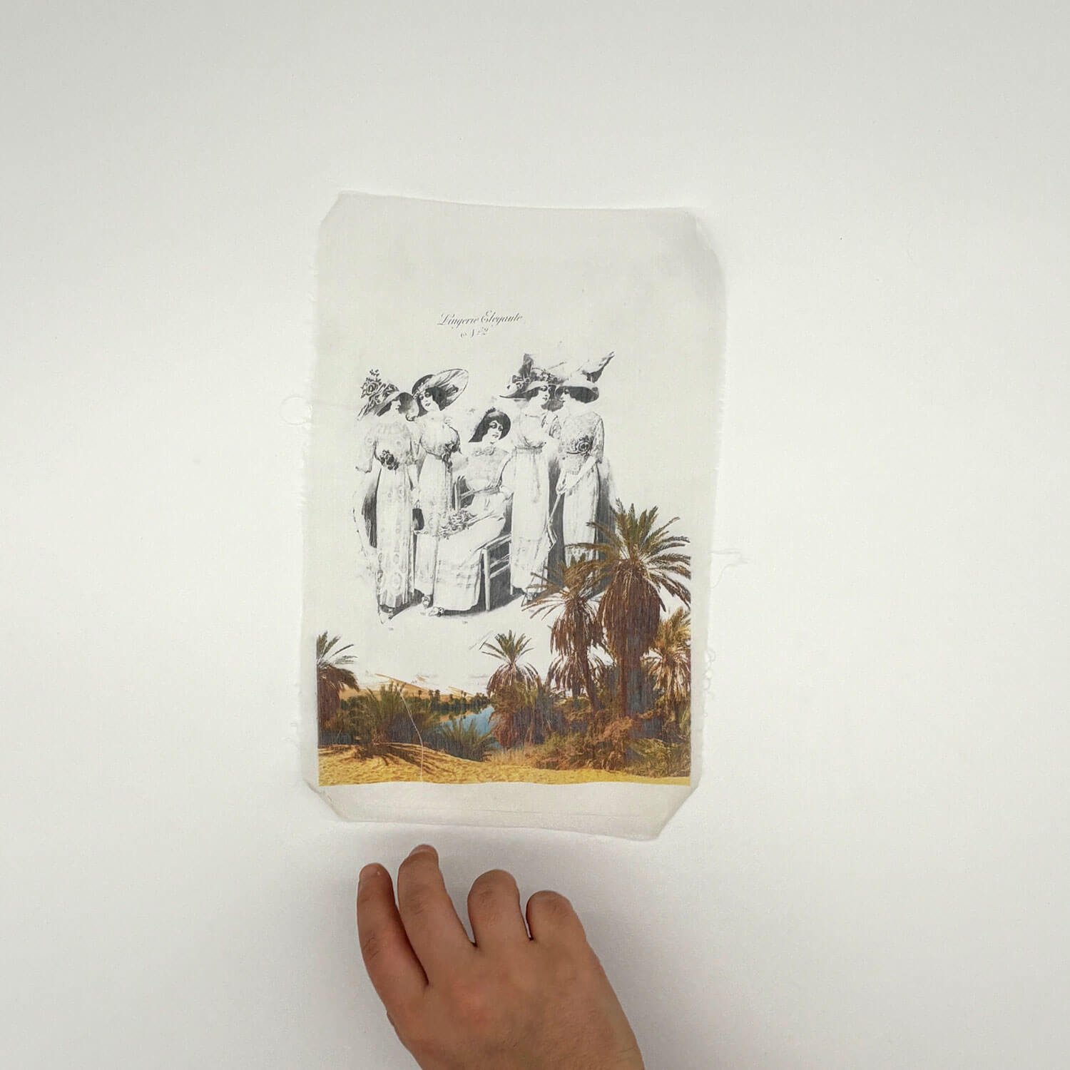 A studio photo of a designer bag and a publication printed on textile