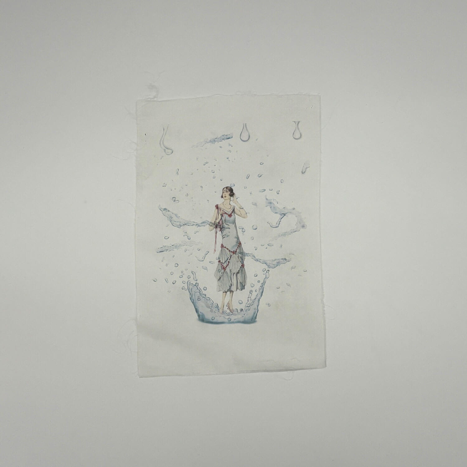 A studio photo of a designer bag and a publication printed on textile