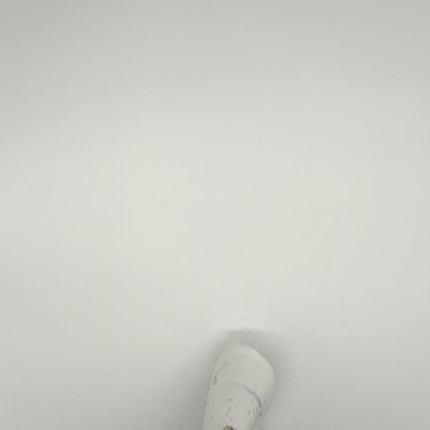 A studio photo of a designer bag and a publication printed on textile