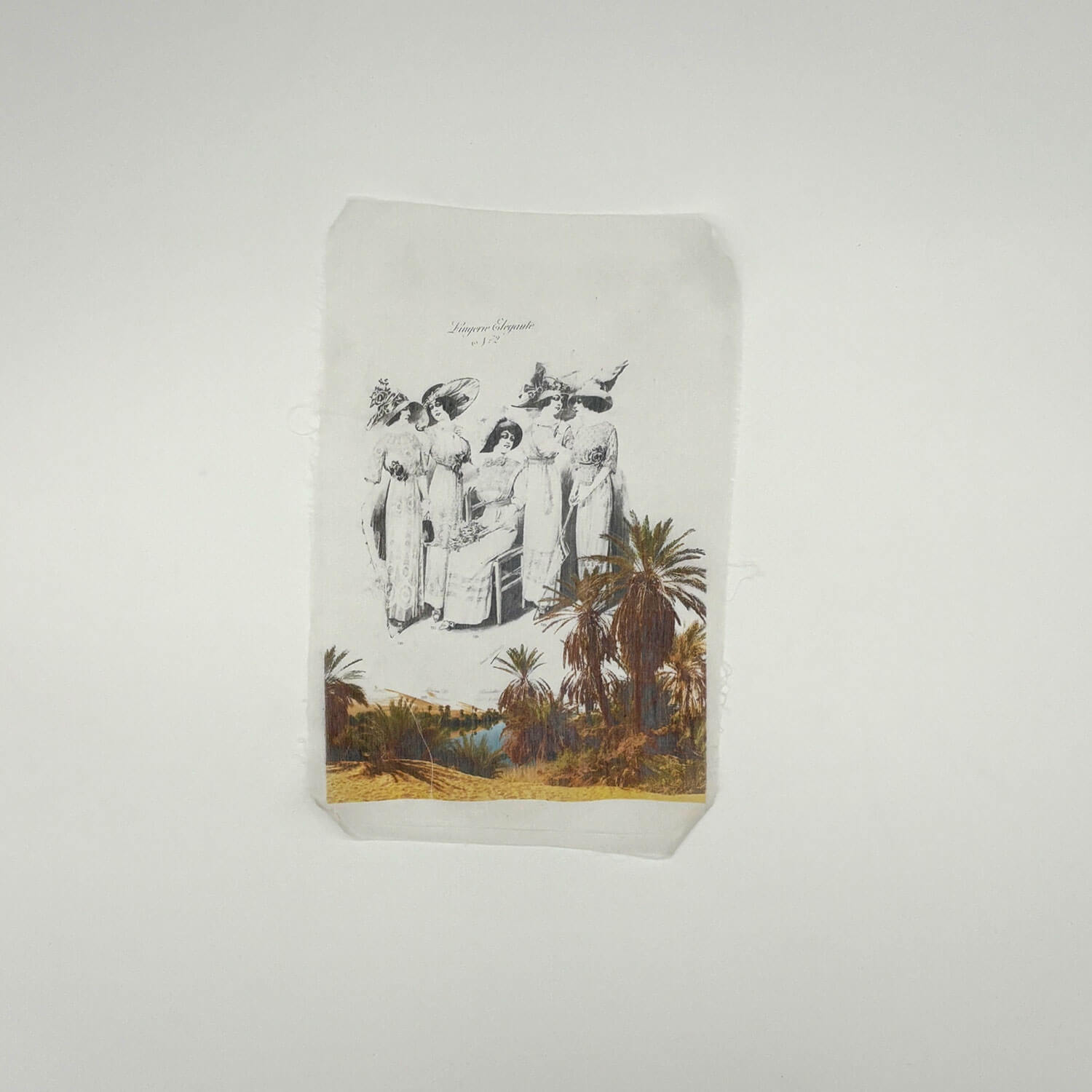 A studio photo of a designer bag and a publication printed on textile