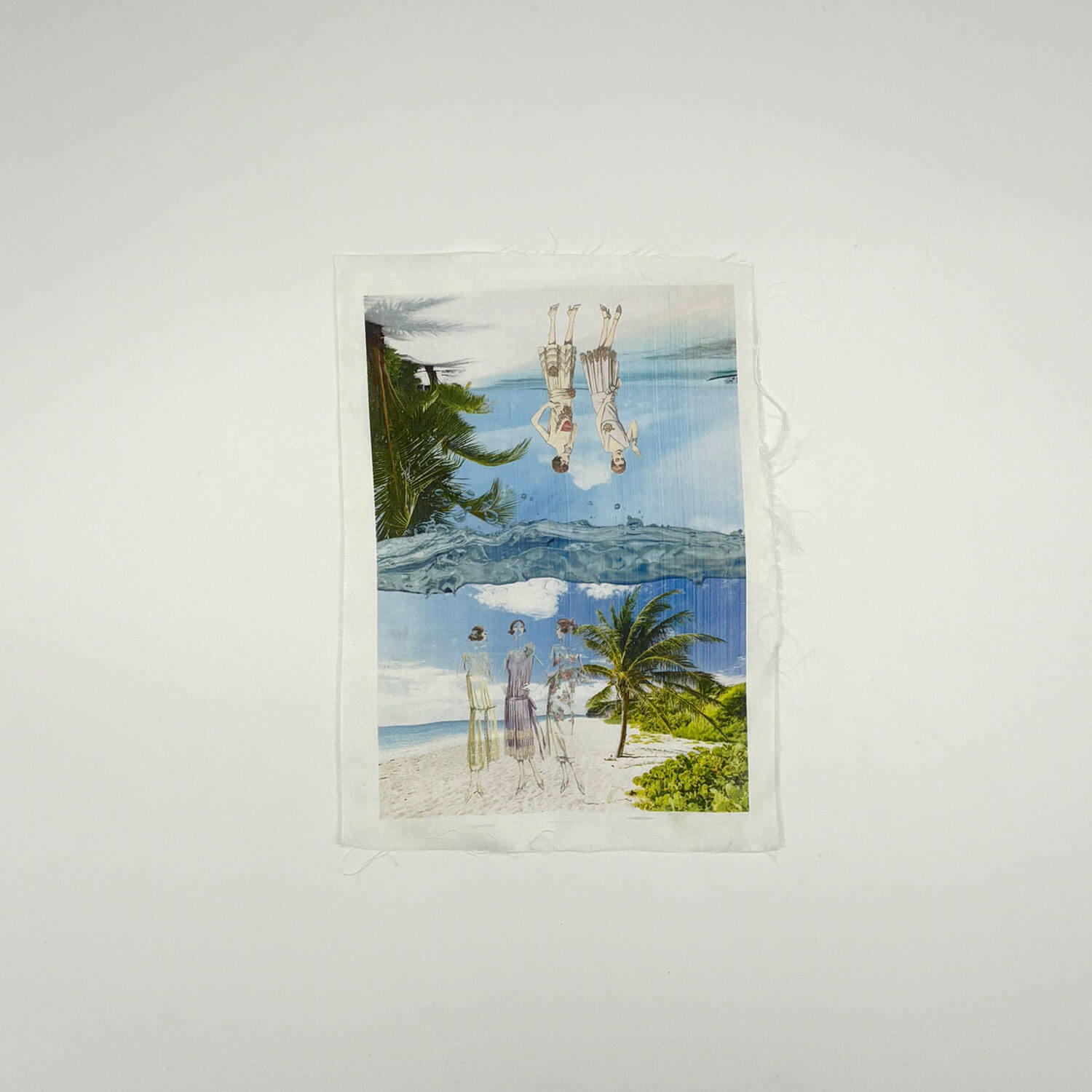 A studio photo of a designer bag and a publication printed on textile