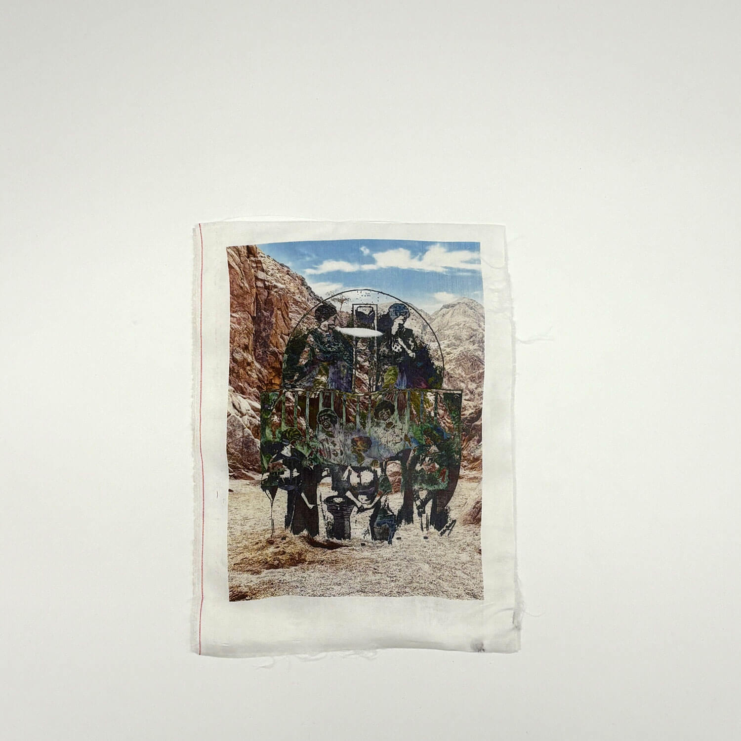 A studio photo of a designer bag and a publication printed on textile