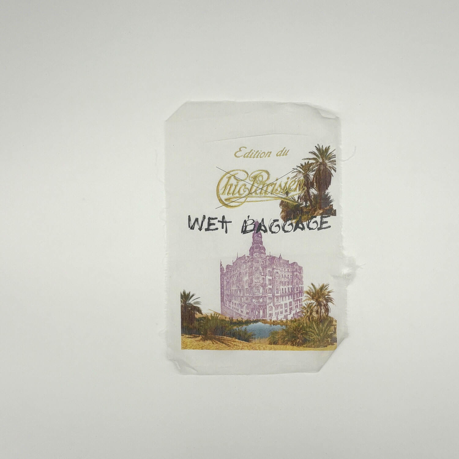 A studio photo of a designer bag and a publication printed on textile