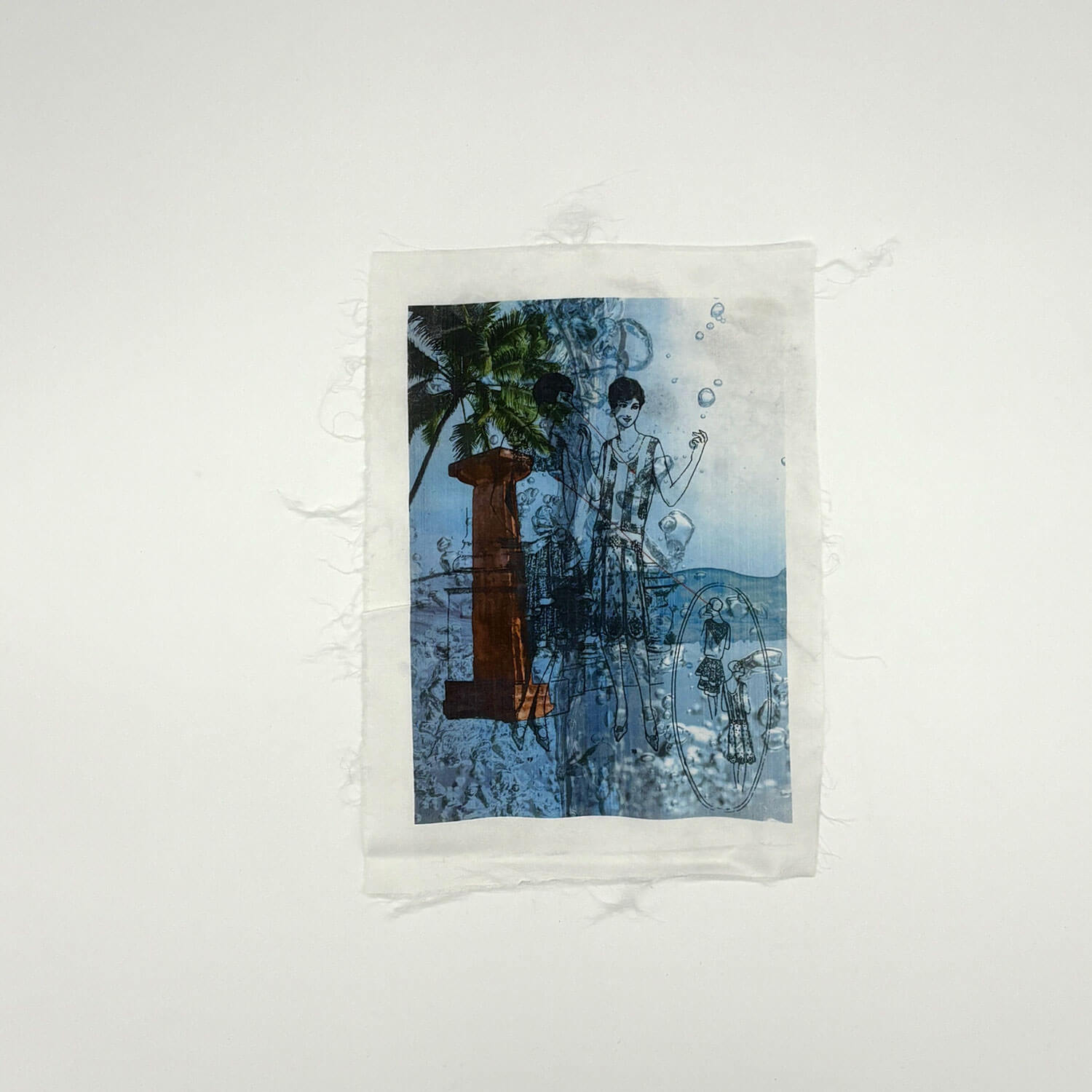 A studio photo of a designer bag and a publication printed on textile