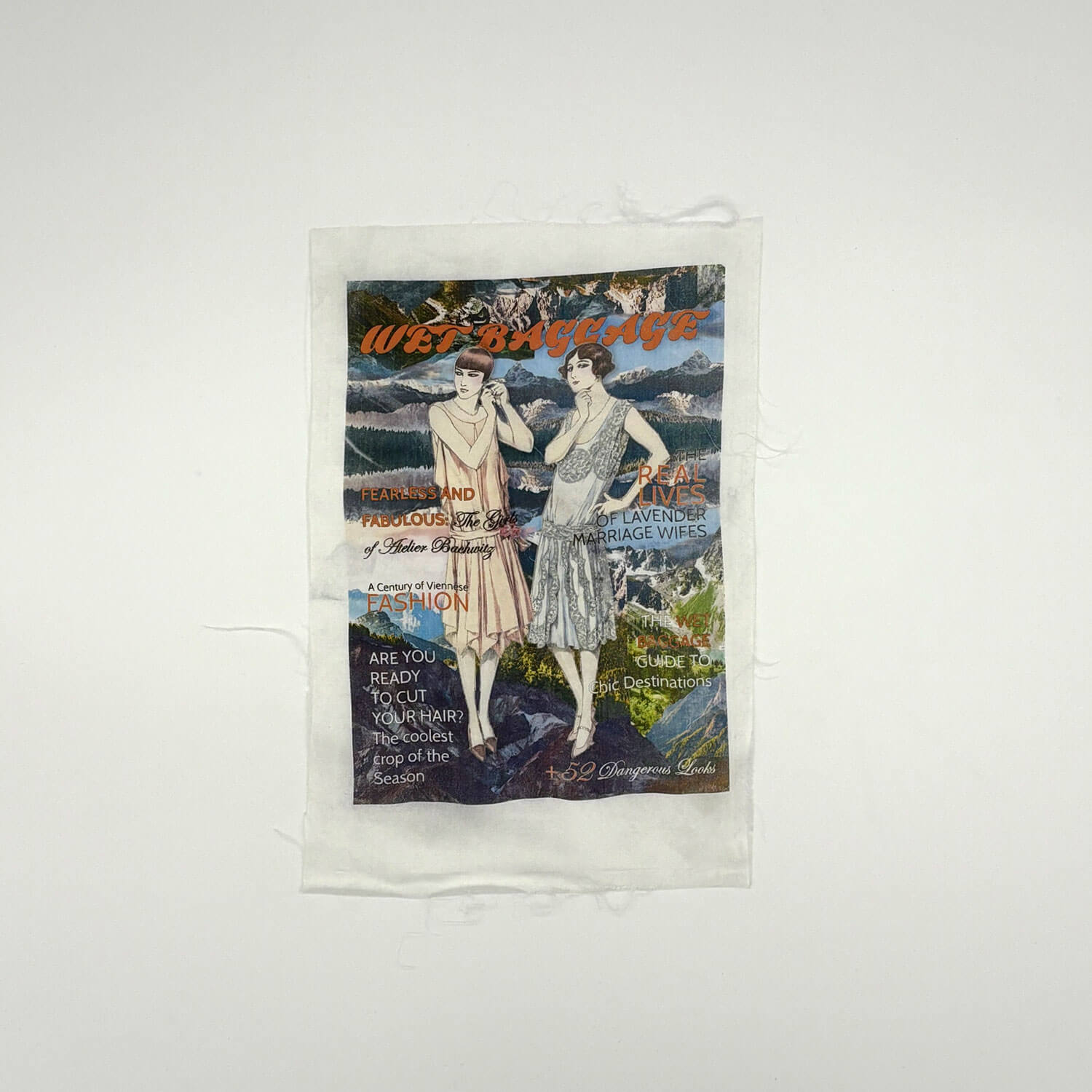 A studio photo of a designer bag and a publication printed on textile