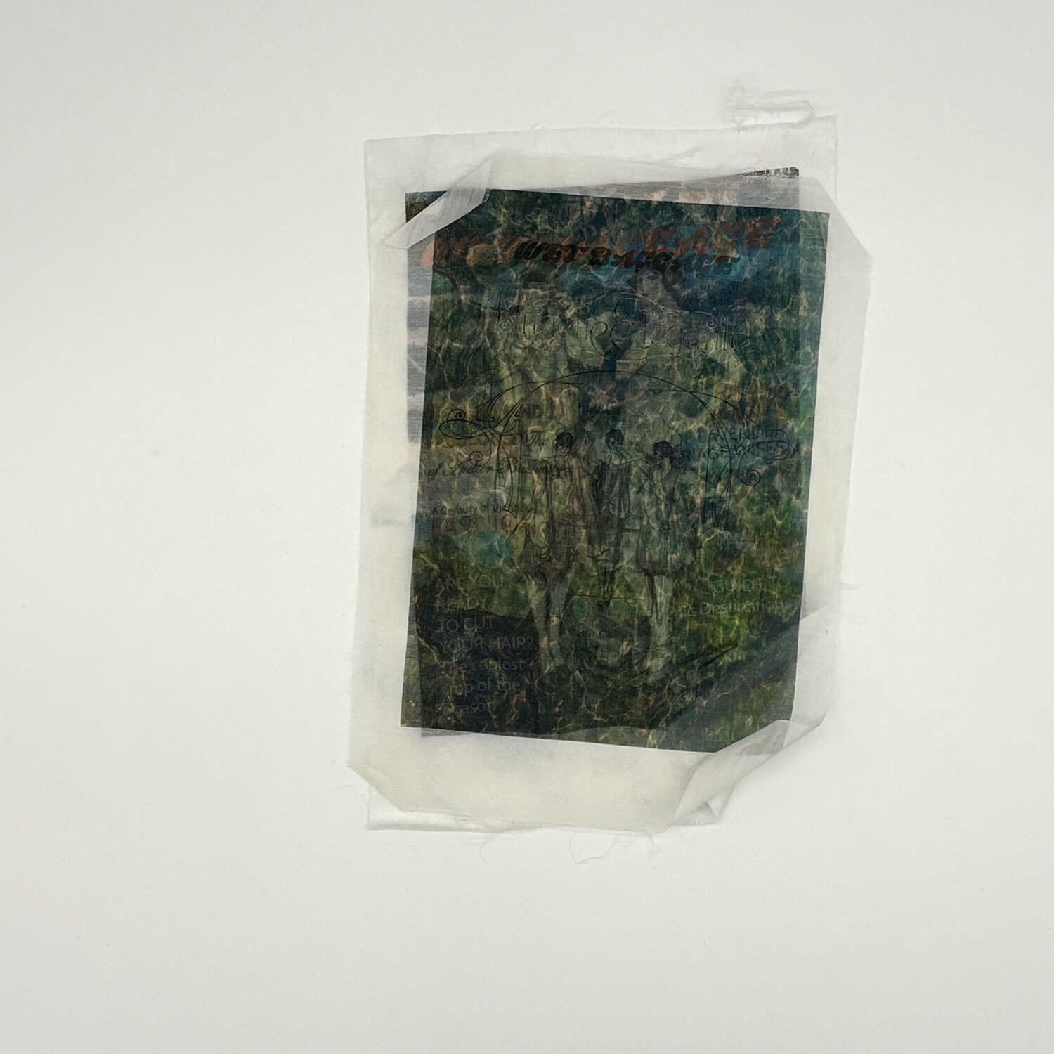 A studio photo of a designer bag and a publication printed on textile