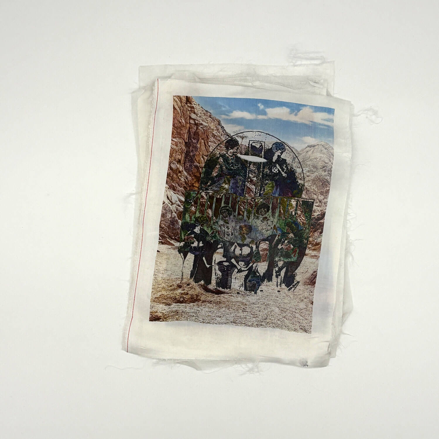 A studio photo of a designer bag and a publication printed on textile