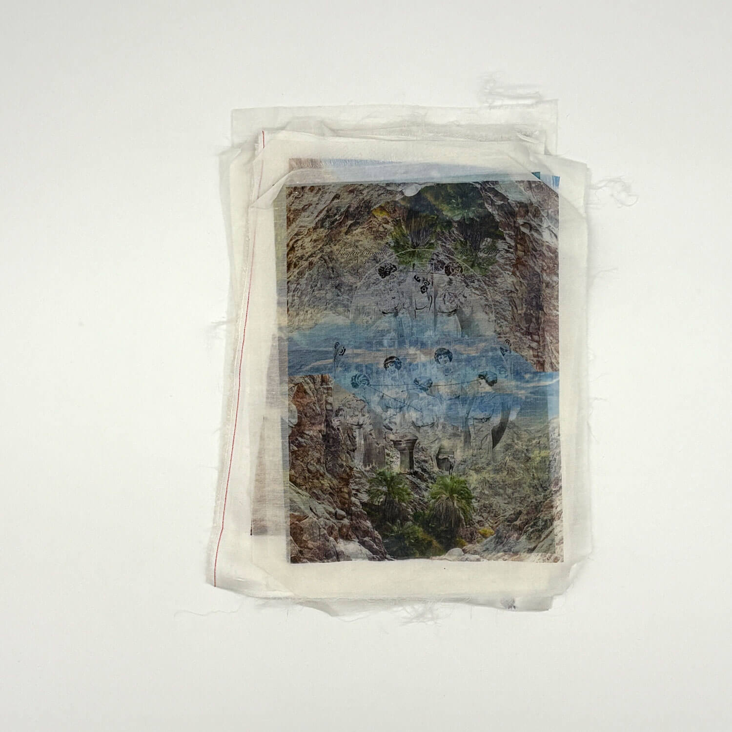 A studio photo of a designer bag and a publication printed on textile