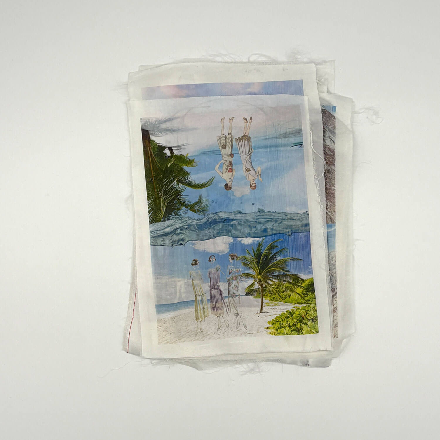 A studio photo of a designer bag and a publication printed on textile