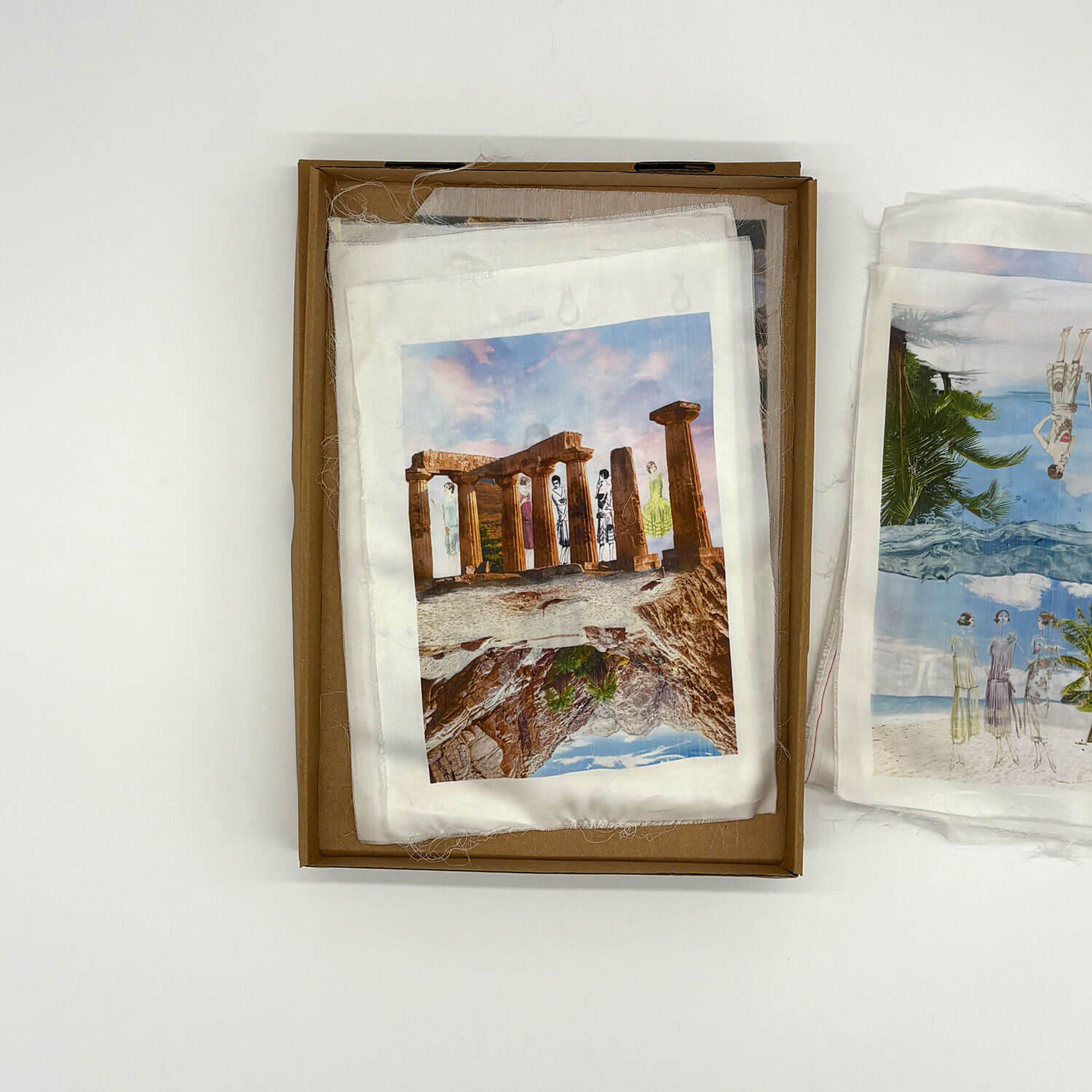 A studio photo of a designer bag and a publication printed on textile