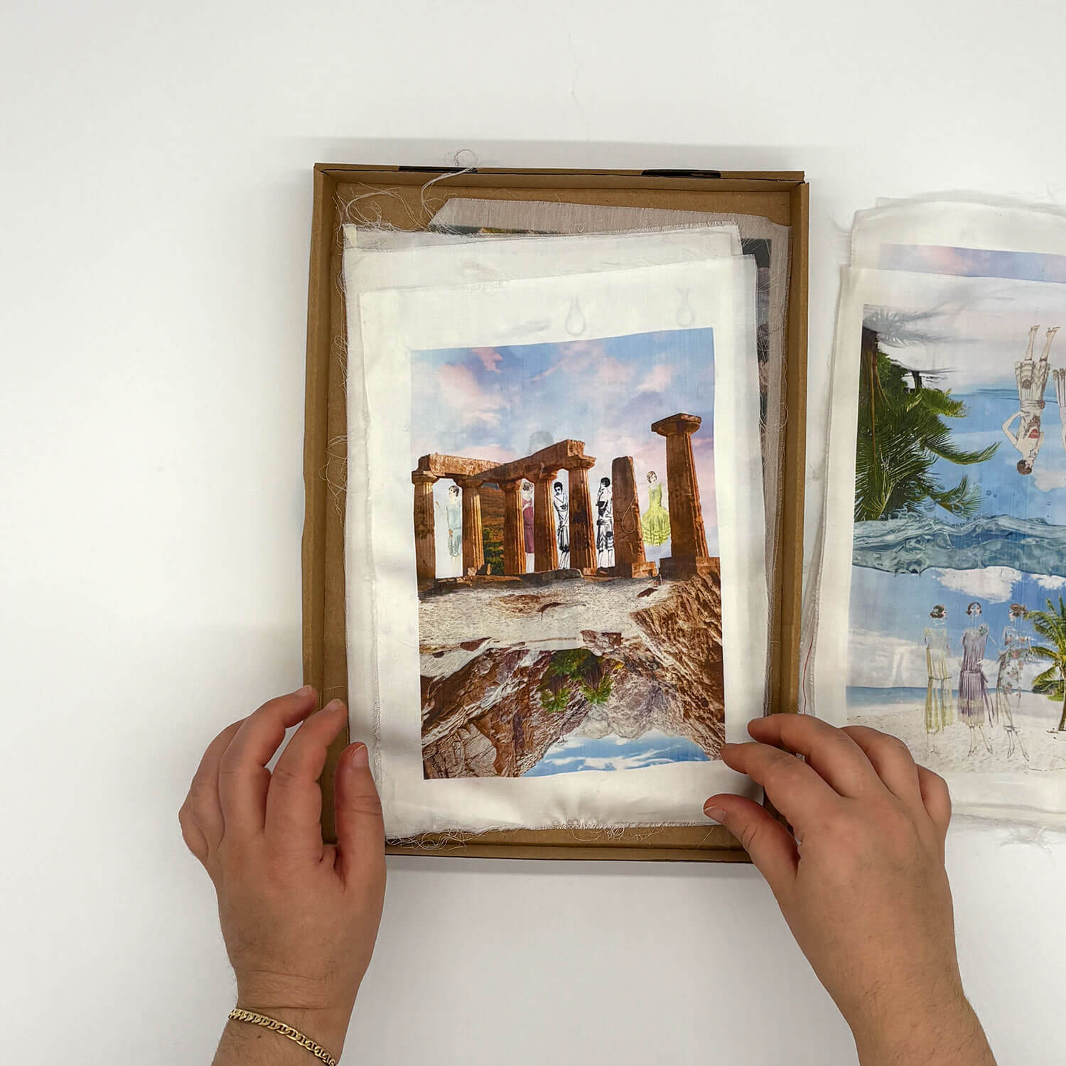 A studio photo of a designer bag and a publication printed on textile