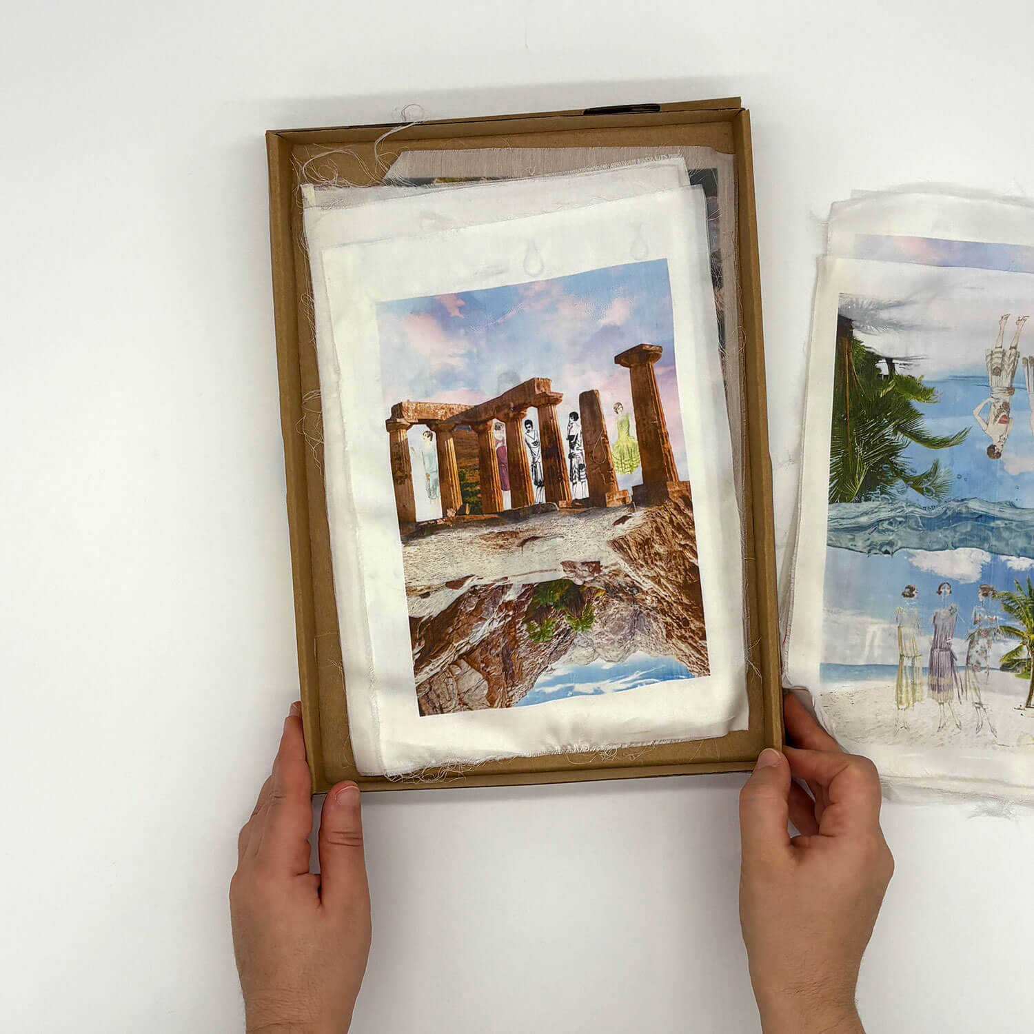 A studio photo of a designer bag and a publication printed on textile