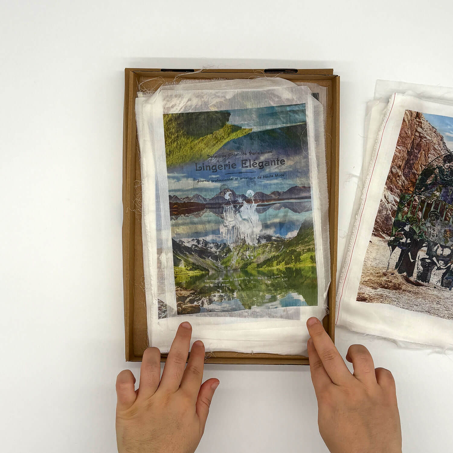 A studio photo of a designer bag and a publication printed on textile