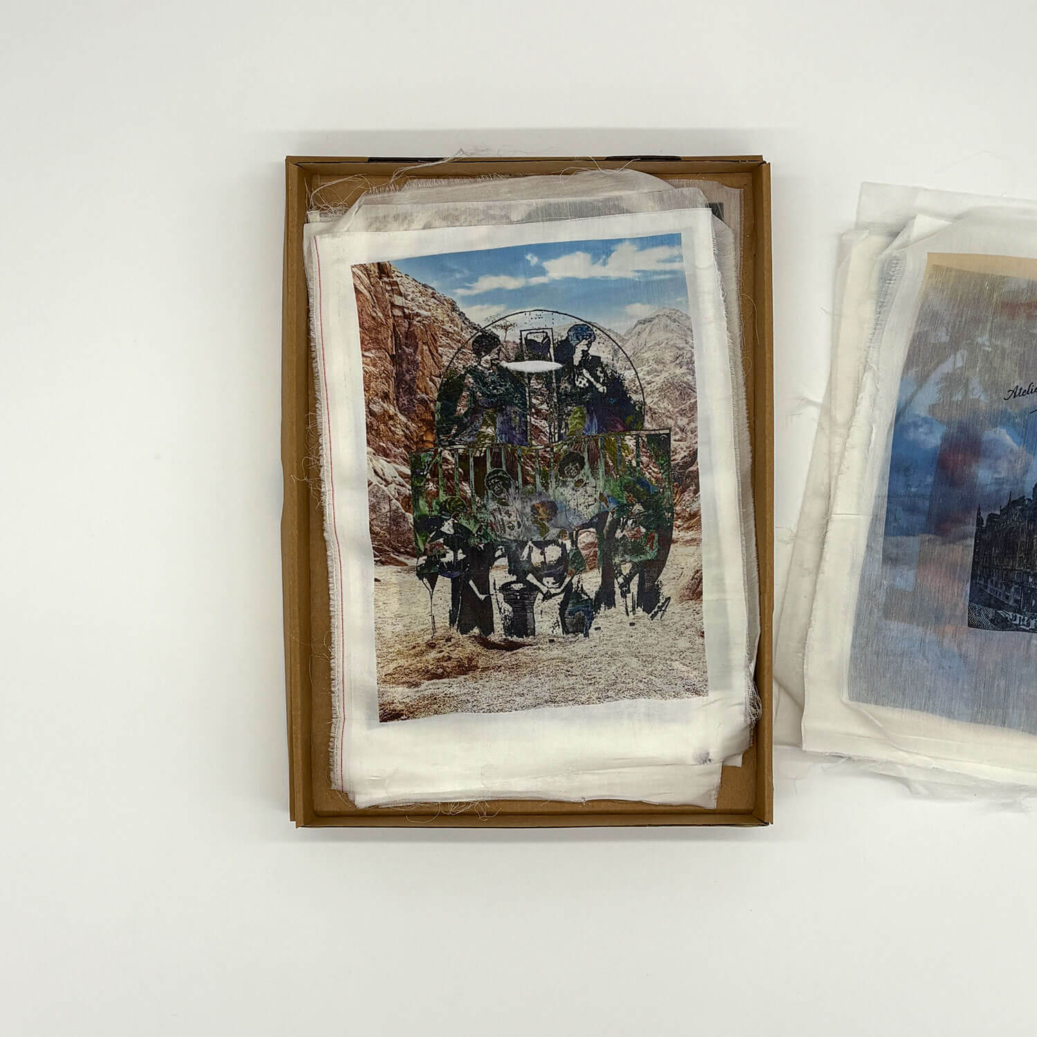 A studio photo of a designer bag and a publication printed on textile