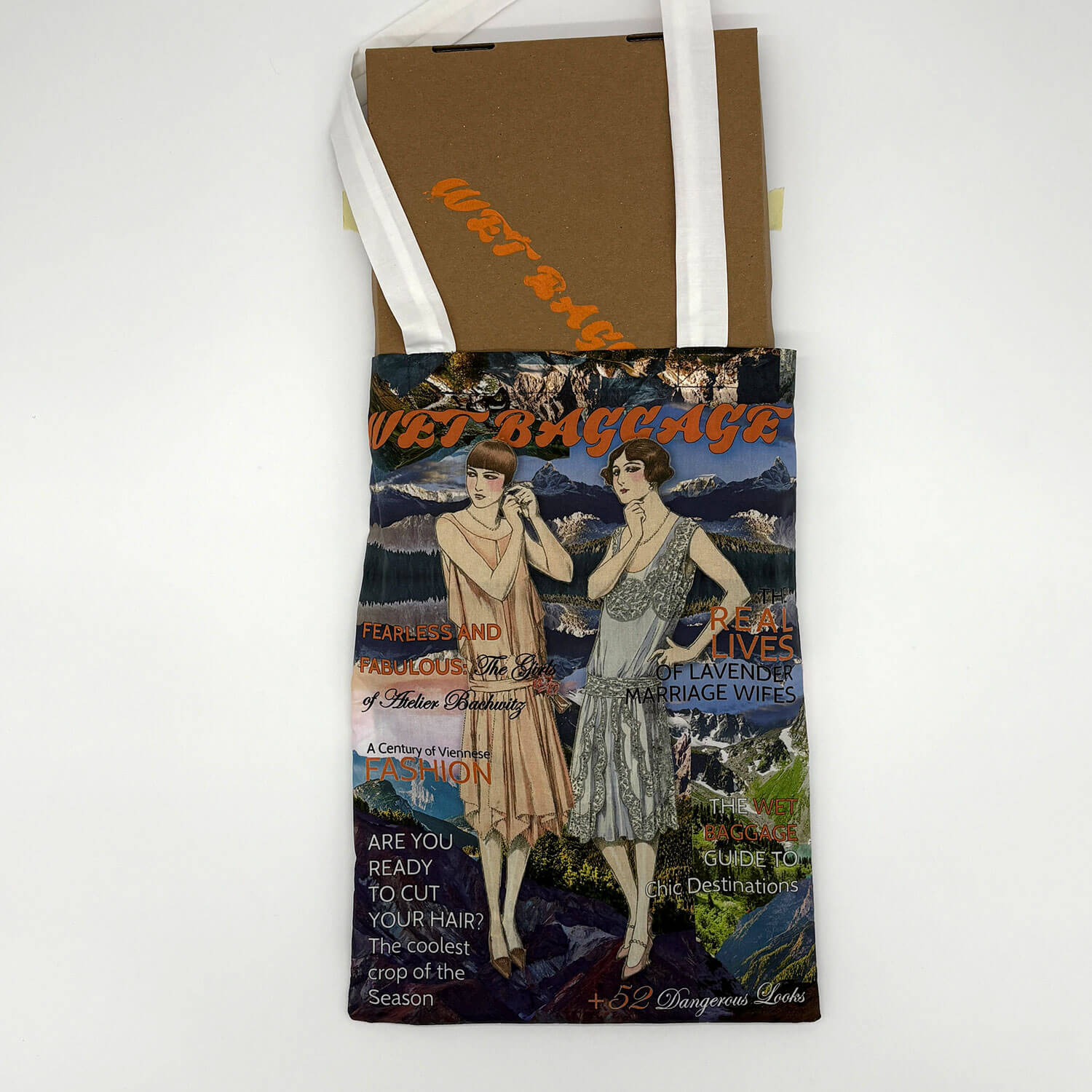 A studio photo of a designer bag and a publication printed on textile