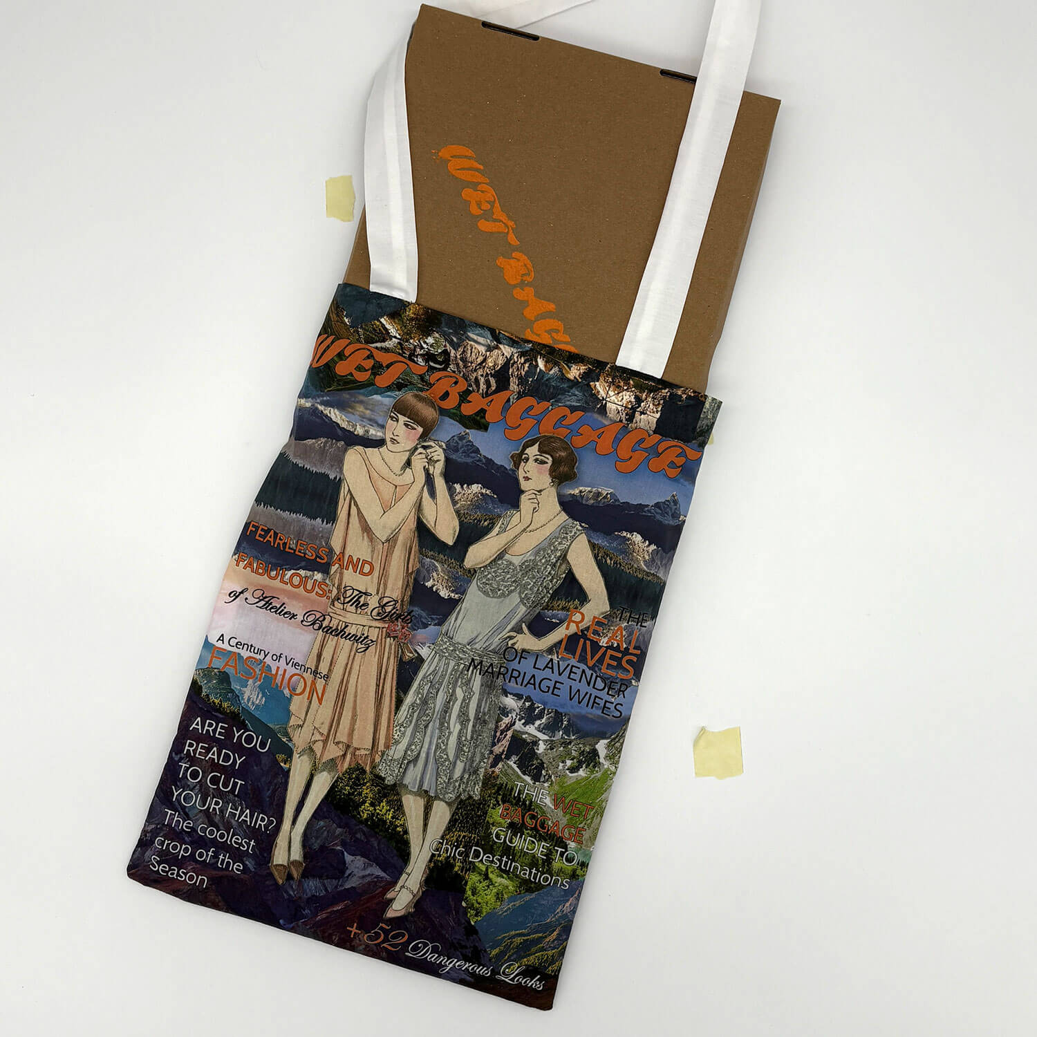 A studio photo of a designer bag and a publication printed on textile