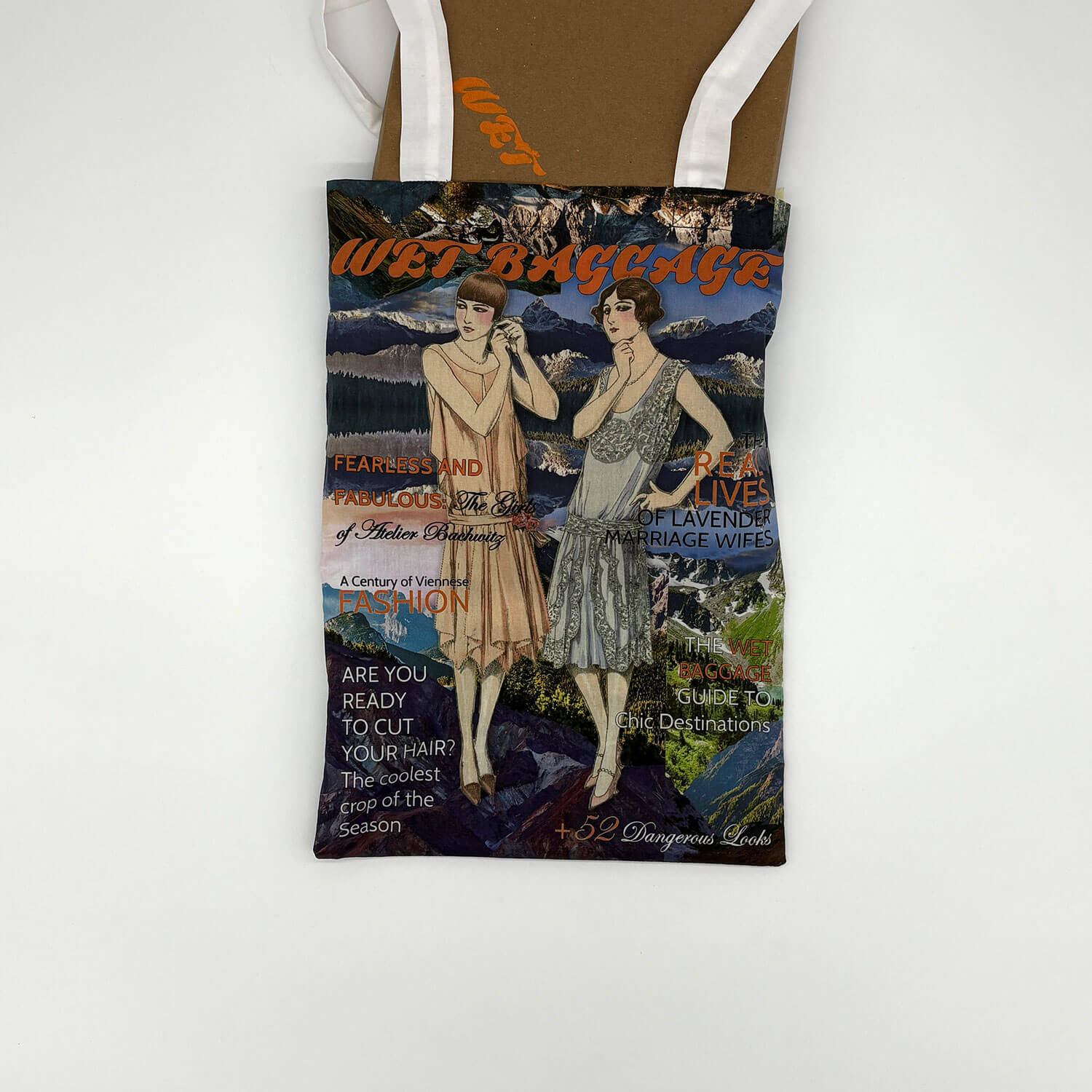 A studio photo of a designer bag and a publication printed on textile