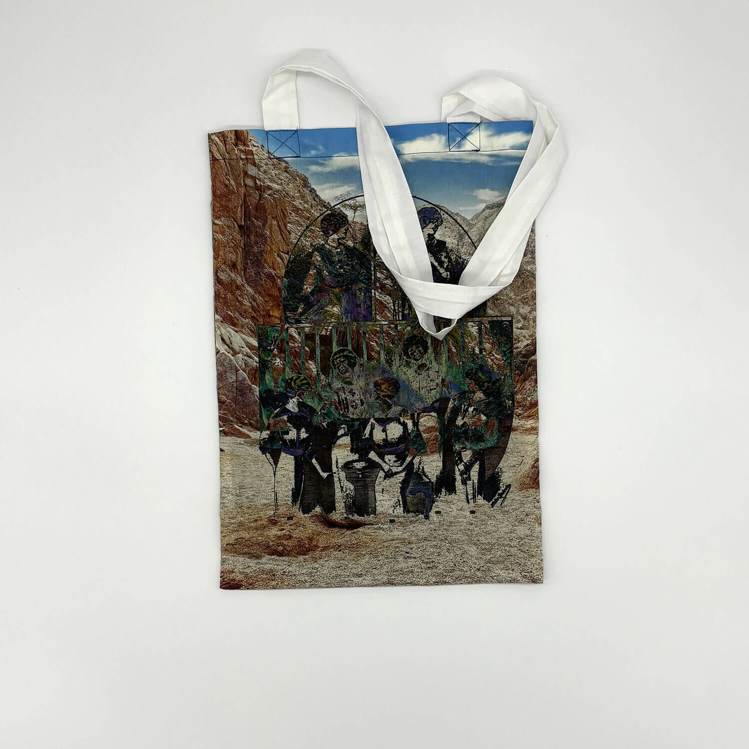 A studio photo of a designer bag and a publication printed on textile