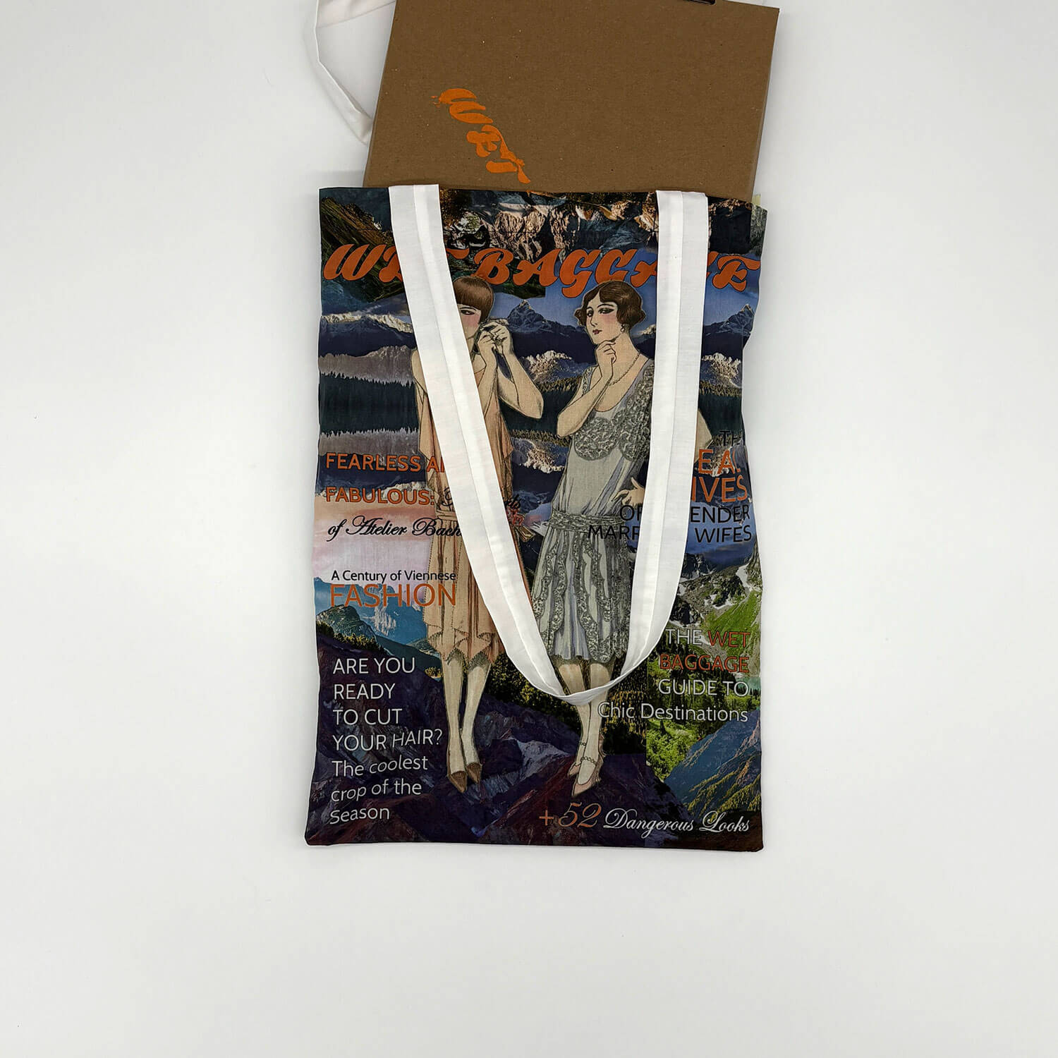 A studio photo of a designer bag and a publication printed on textile