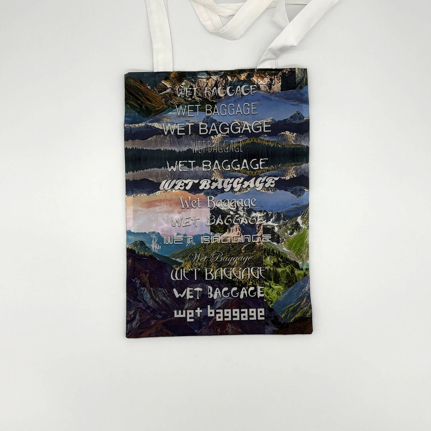 A studio photo of a designer bag and a publication printed on textile