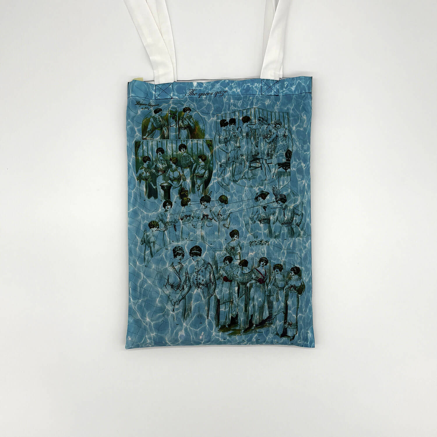 A studio photo of a designer bag and a publication printed on textile