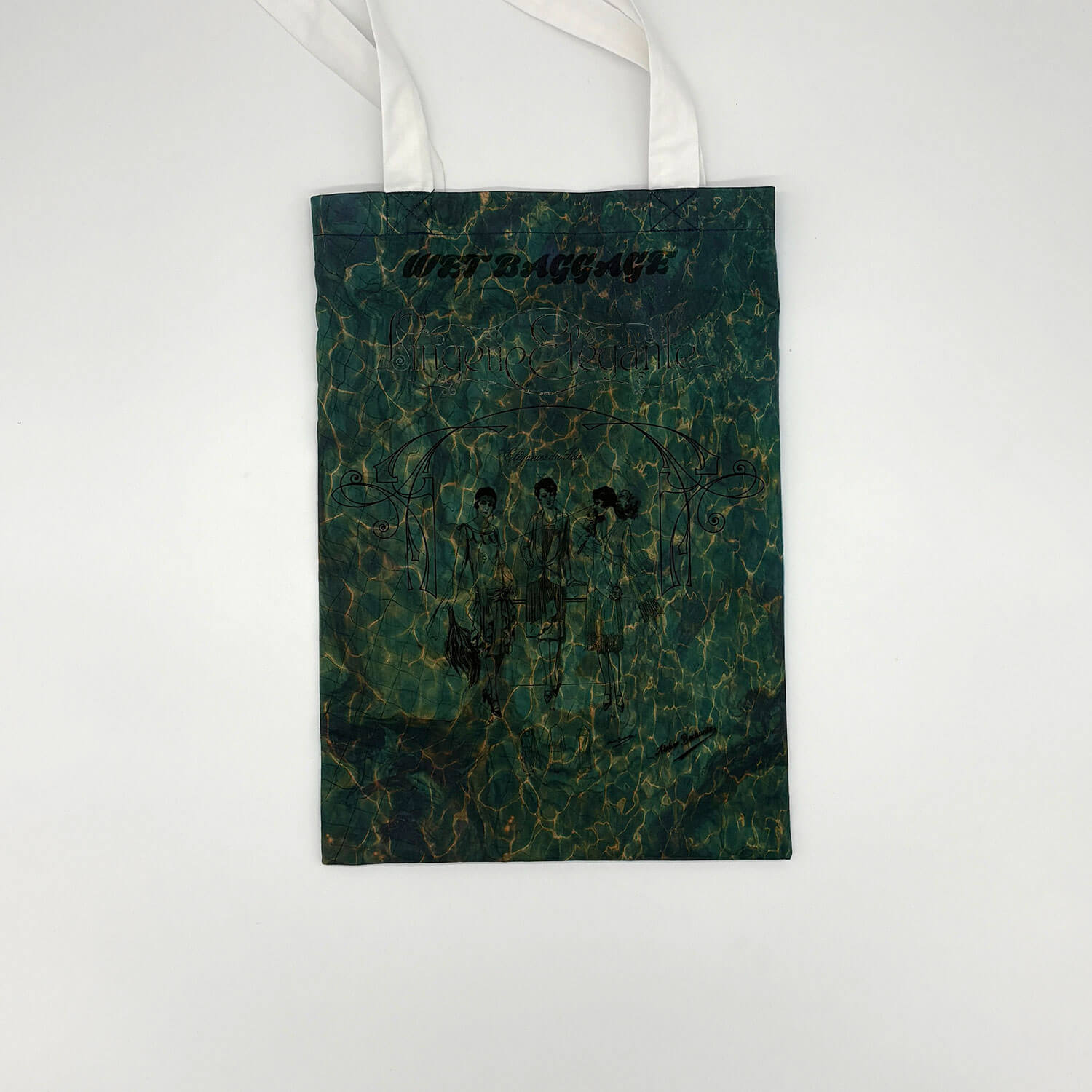 A studio photo of a designer bag and a publication printed on textile