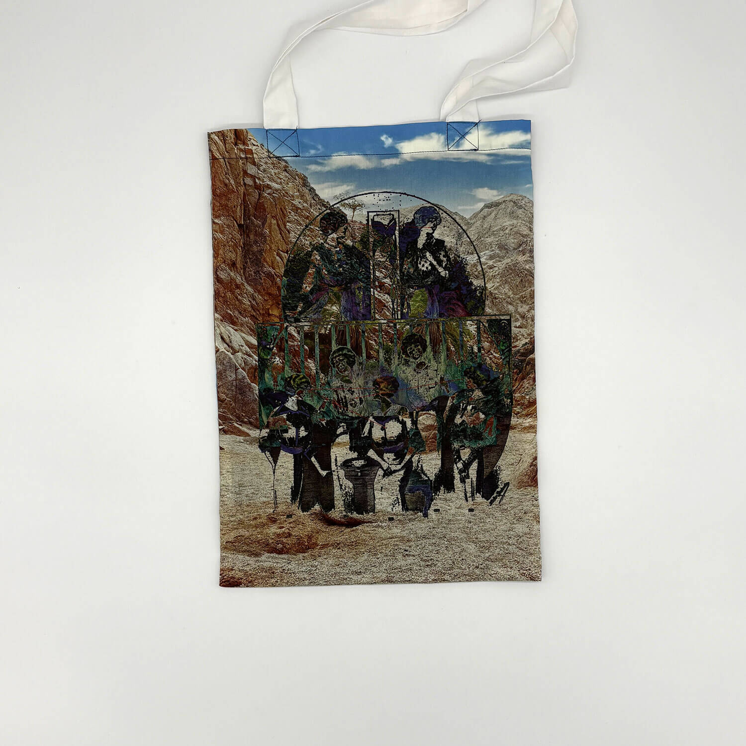 A studio photo of a designer bag and a publication printed on textile