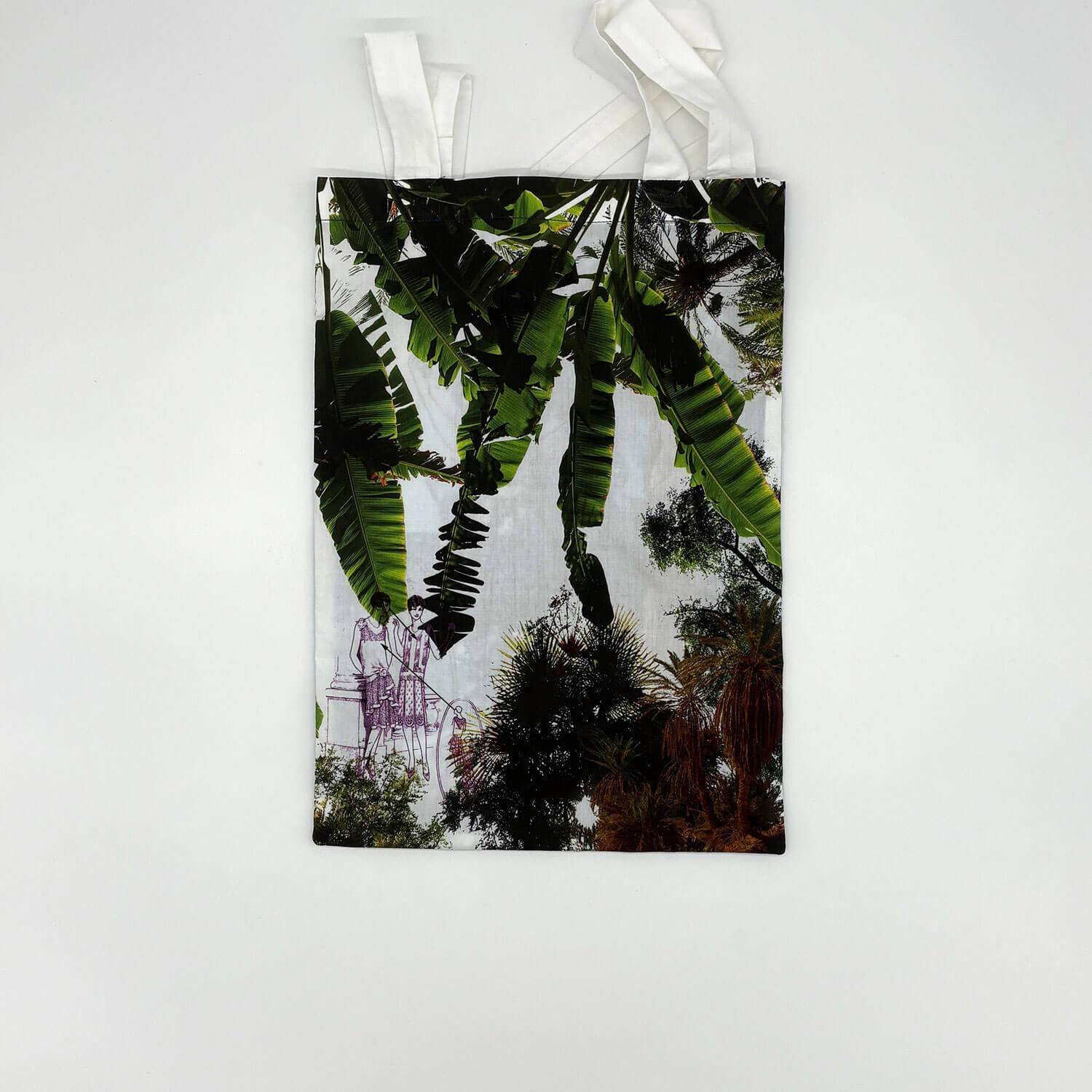 A studio photo of a designer bag and a publication printed on textile