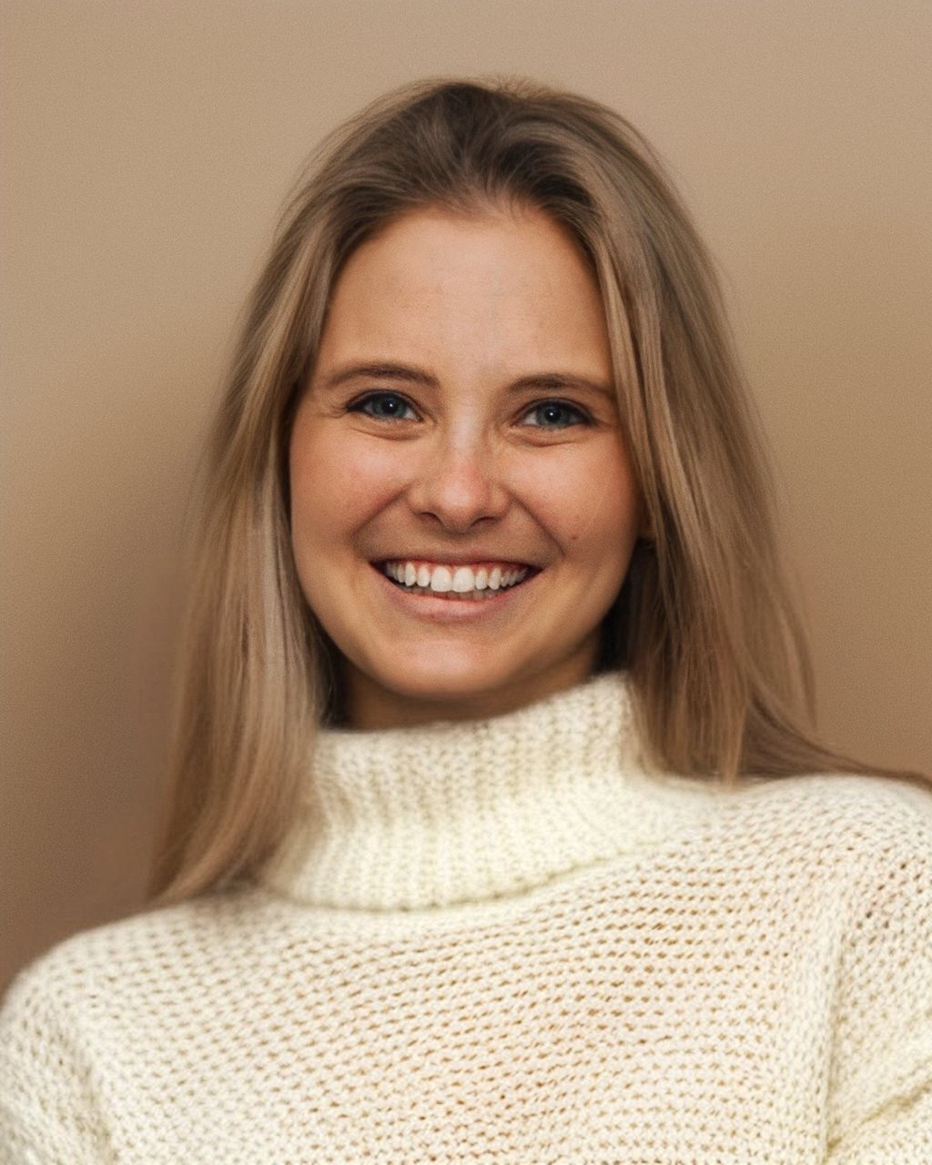 Headshot of Lauren Schrero, a white woman with long blond hair wearing a cream turtleneck.  