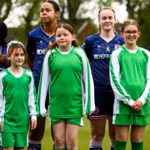 Lyndhurst Girls Football Team walk out with Dulwich Hamlet FC