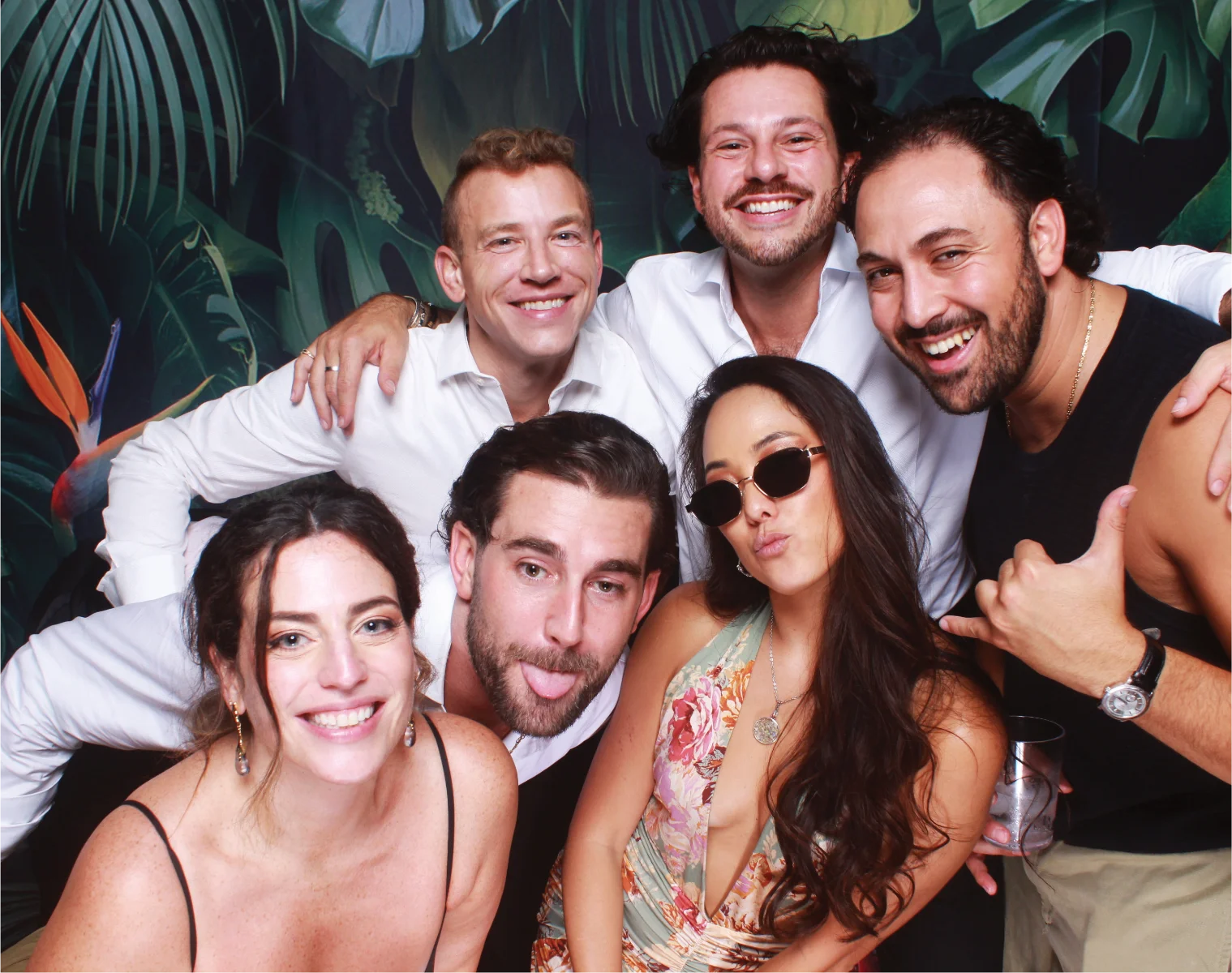 Wedding guests enjoying a group photo booth portrait.