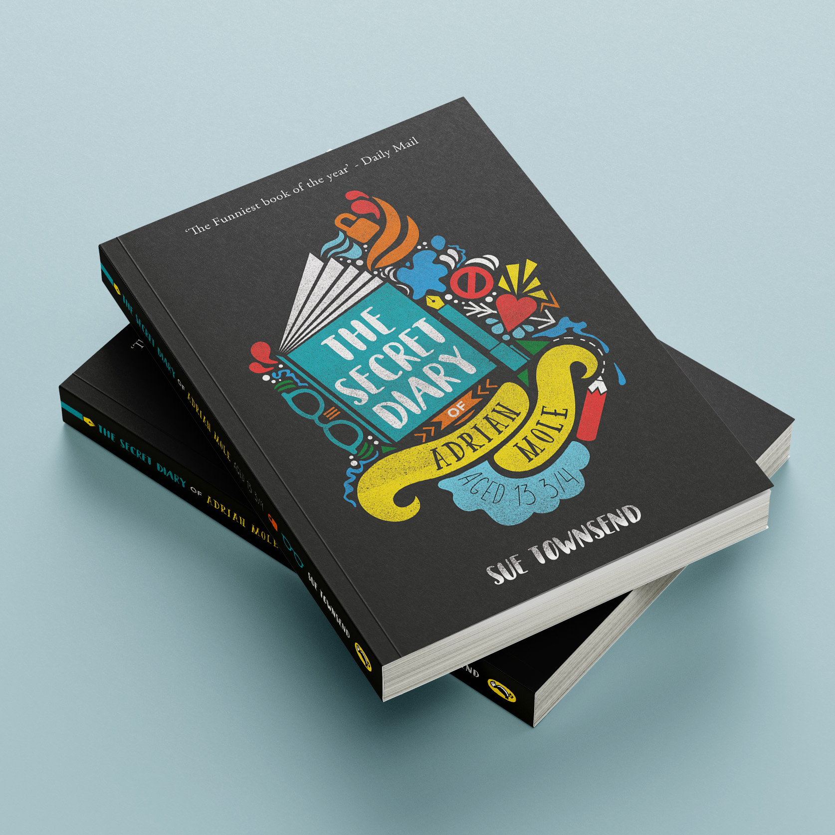 Two books stacked on a light blue surface. The cover shows a mid-opening diary made of geometric shapes on charcoal grey, with colourful elements spilling out—glasses, open padlock, fountain pen, no entry sign, arrow through a heart, and ink splat.