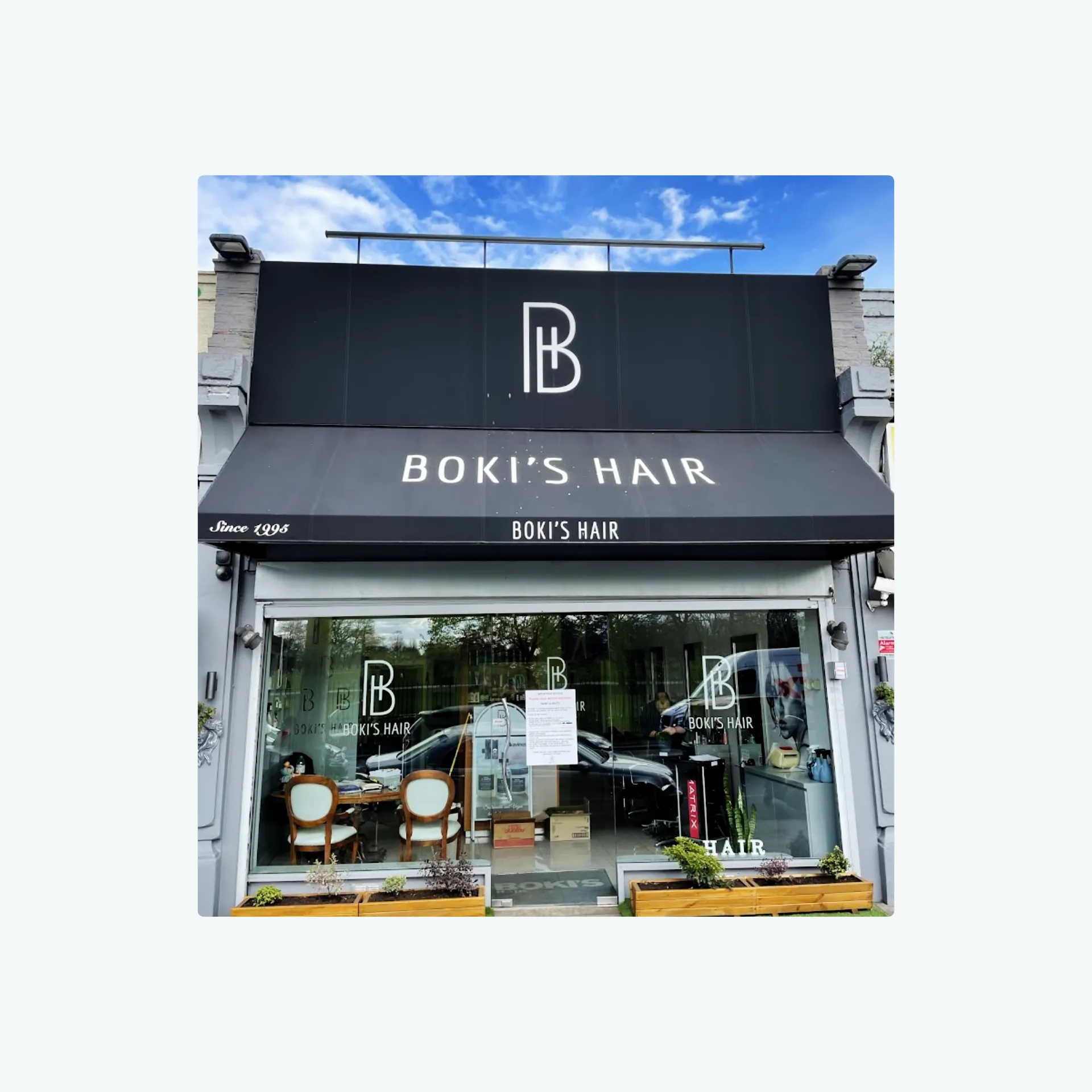 Photo of Boki’s Hair salon frontage showing their Monogram BH logo in situ.