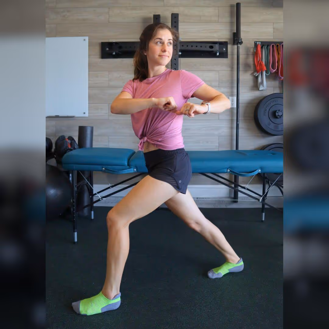 A girl standing in a lunge position, rotating to the left while keeping her feet still 