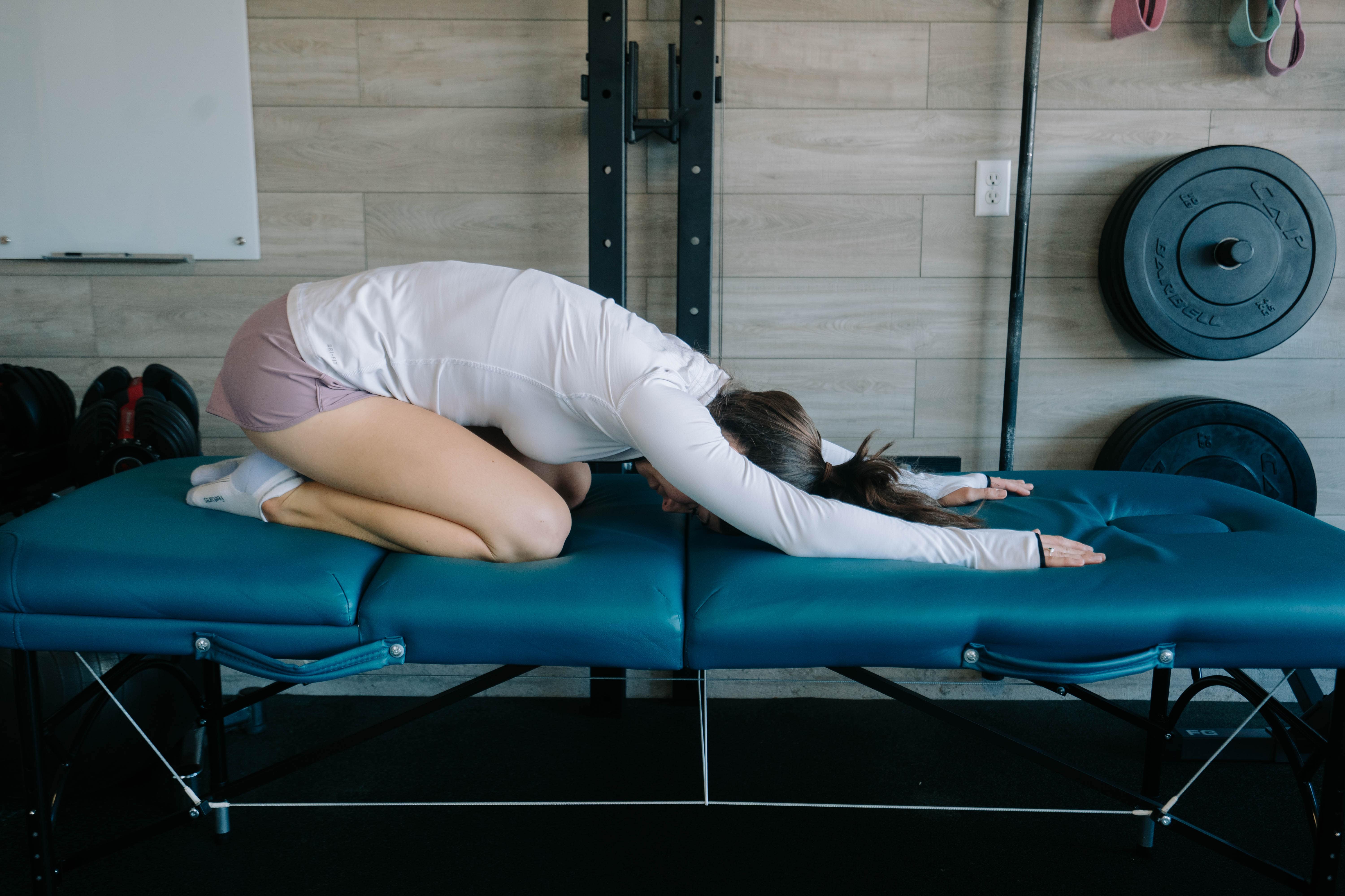 Women Showing A Child's Pose Stretch