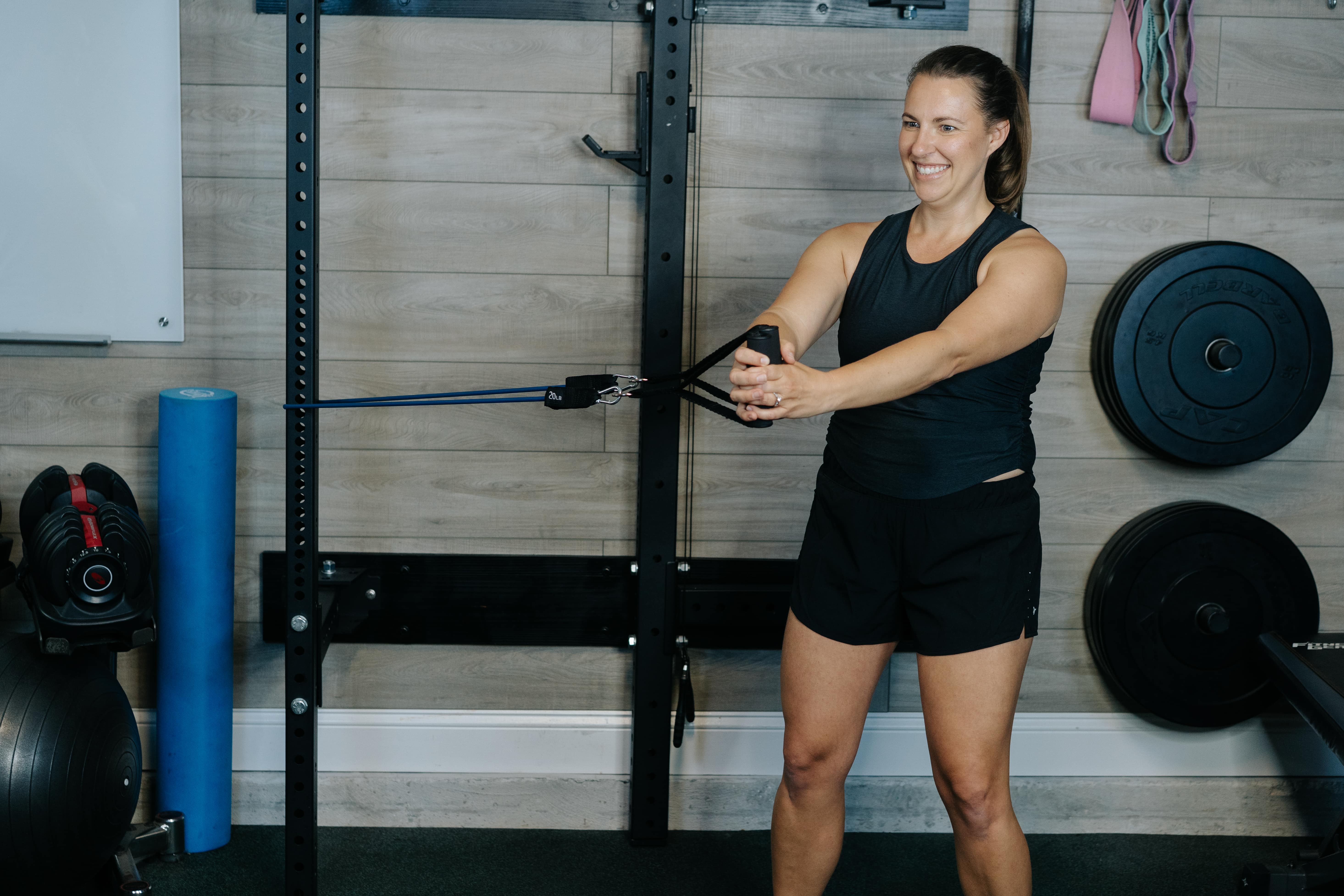 Women demonstrating Pallof Press stretch for your core