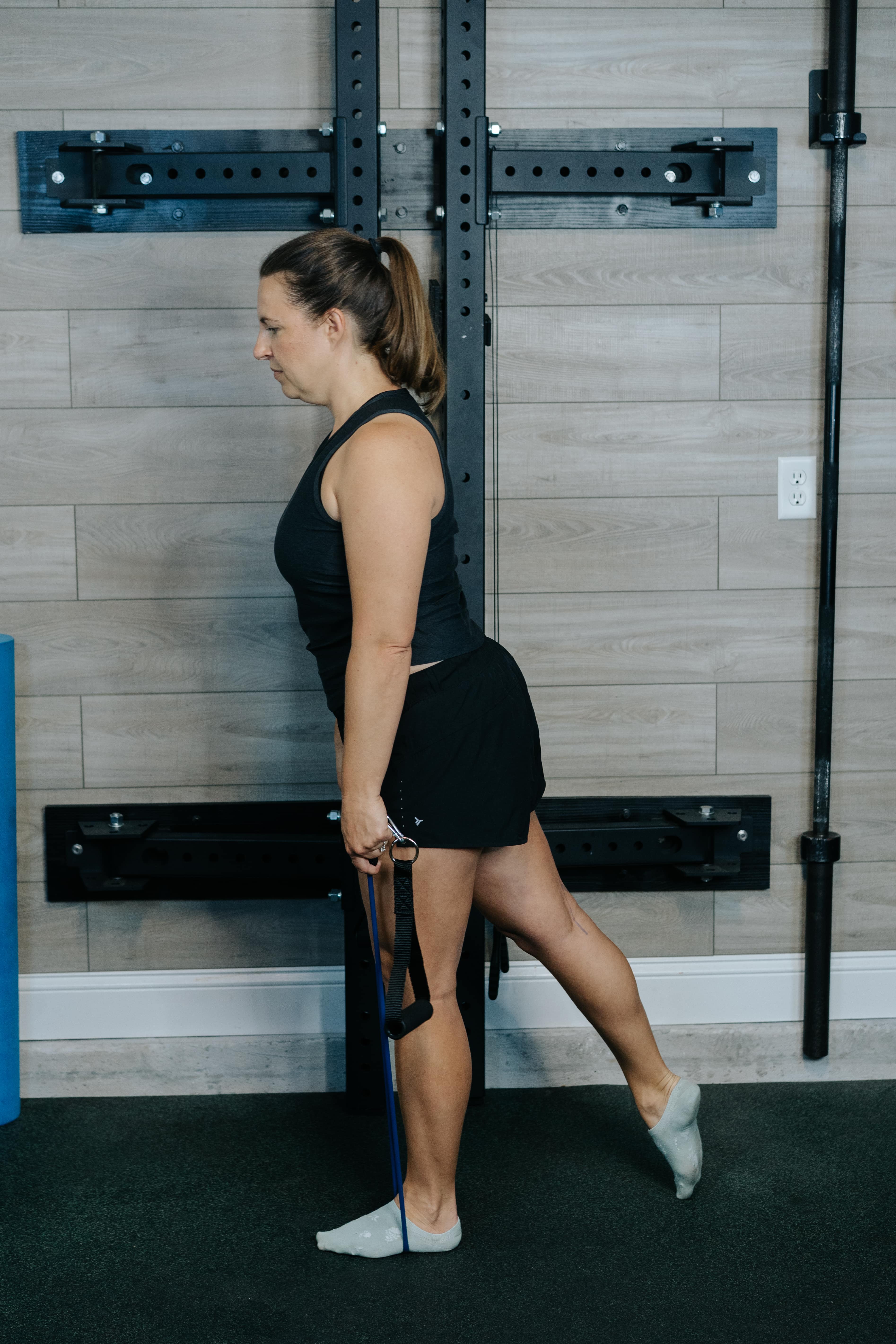 Women in the starting position for Banded Romanian Deadlifts
