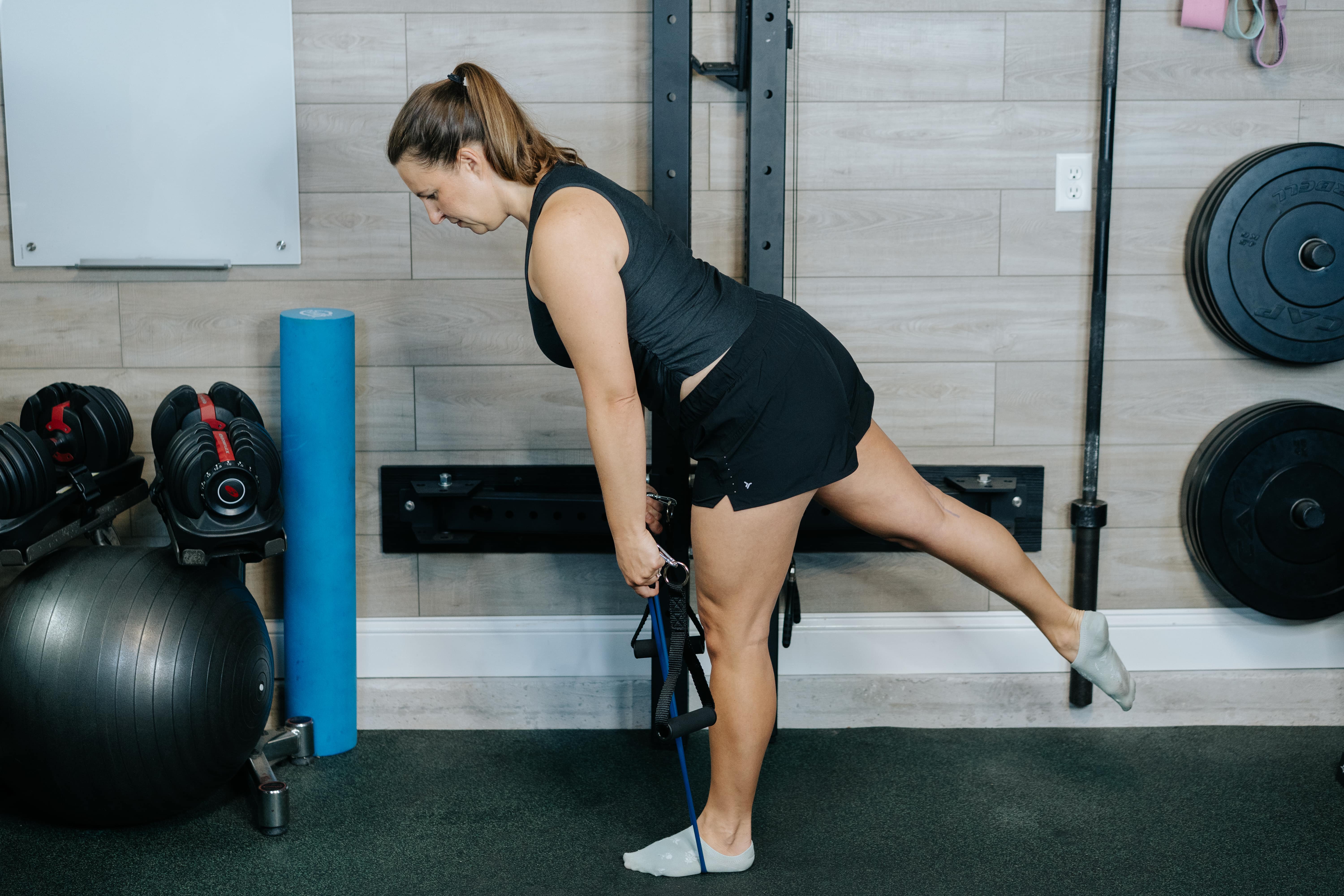Women showing the Banded Romanian Deadlifts stretch