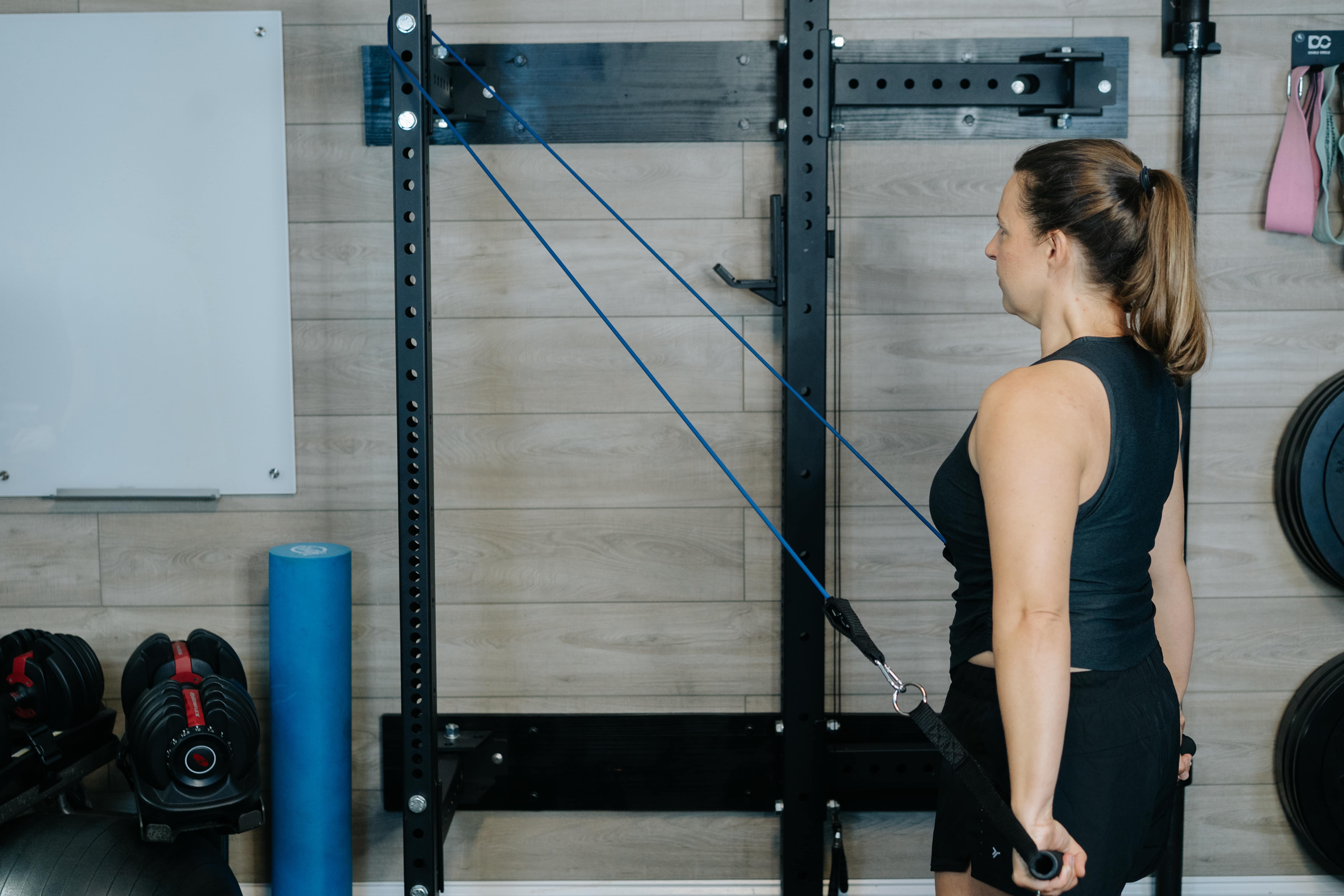 Women demonstrating standing shoulder extensions with arms pulled back