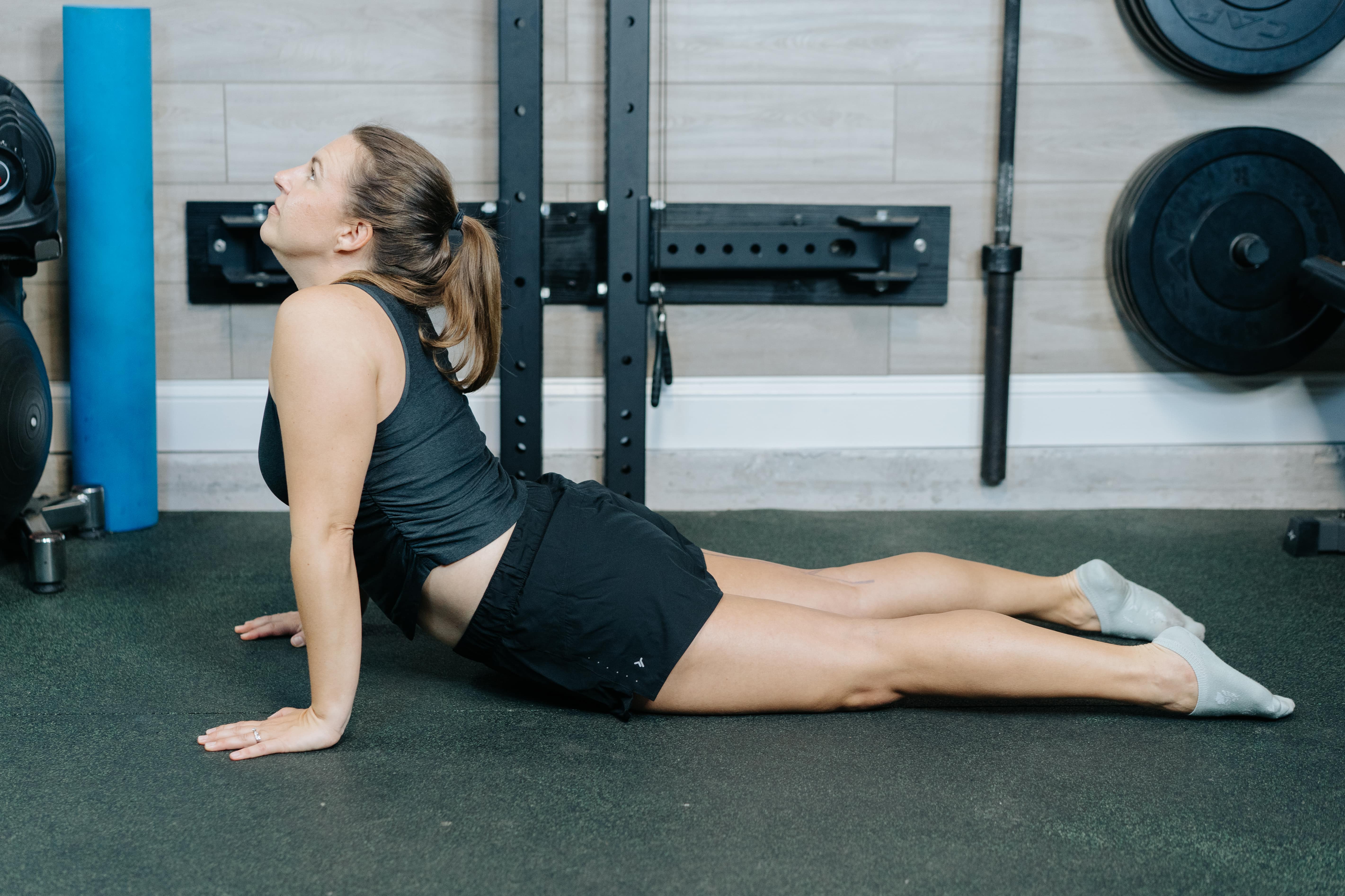 Women doing the press up when doing the downward dog