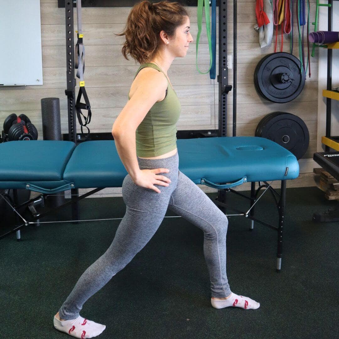 Women demonstrating a standing hip flexor stretch